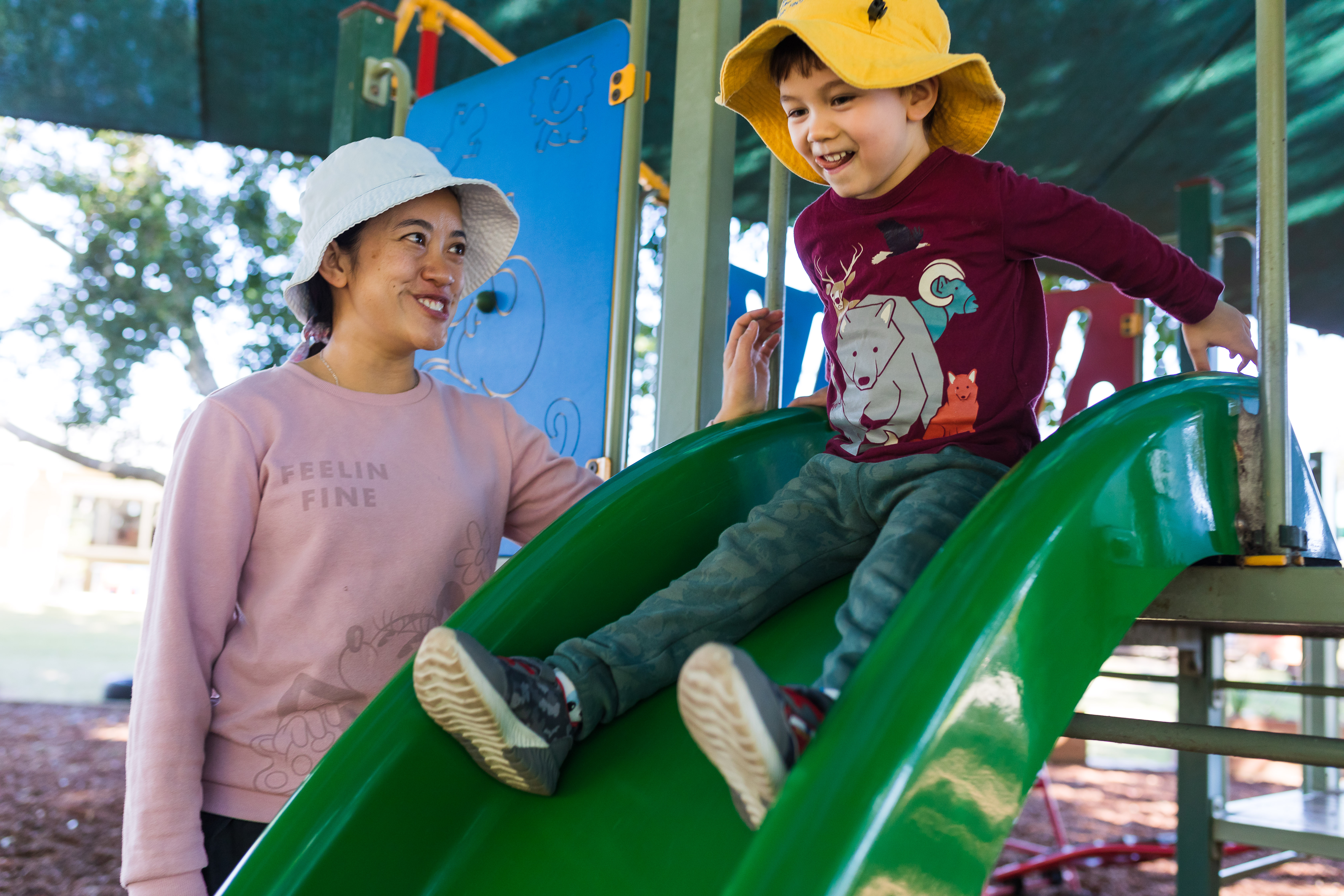 Child and educator on playground