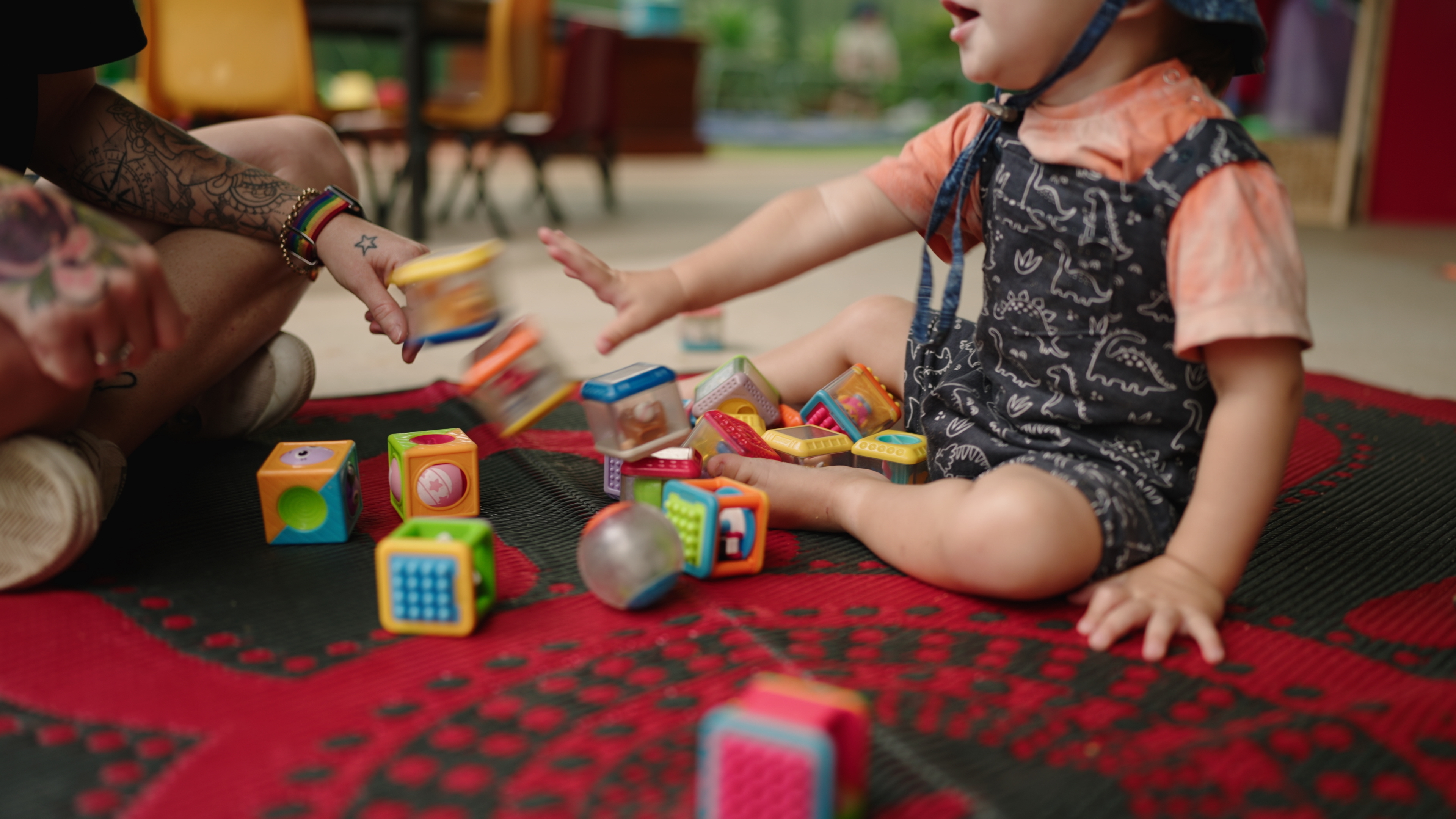 C&K toddler playing with educator