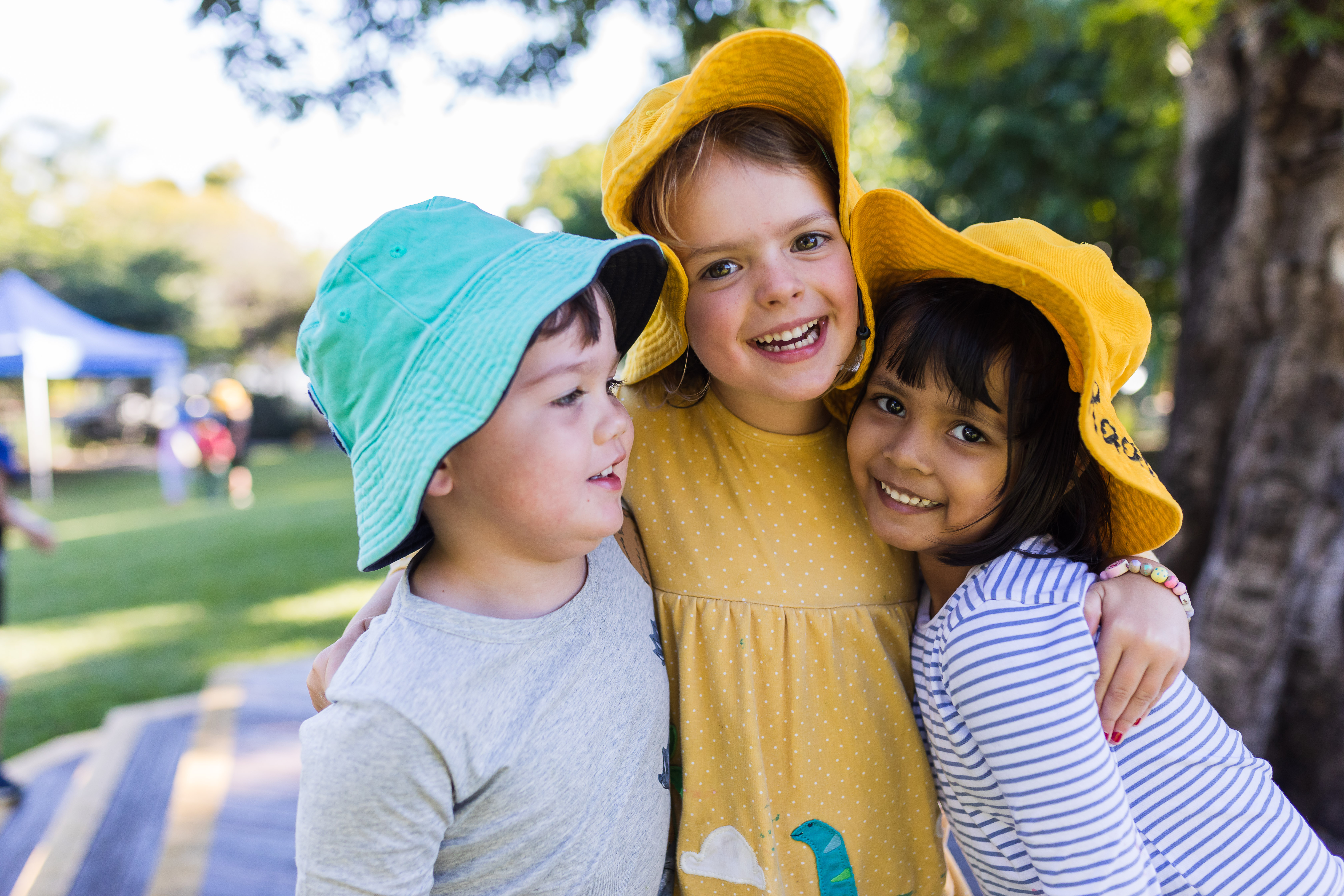 Three c&k children smiling together
