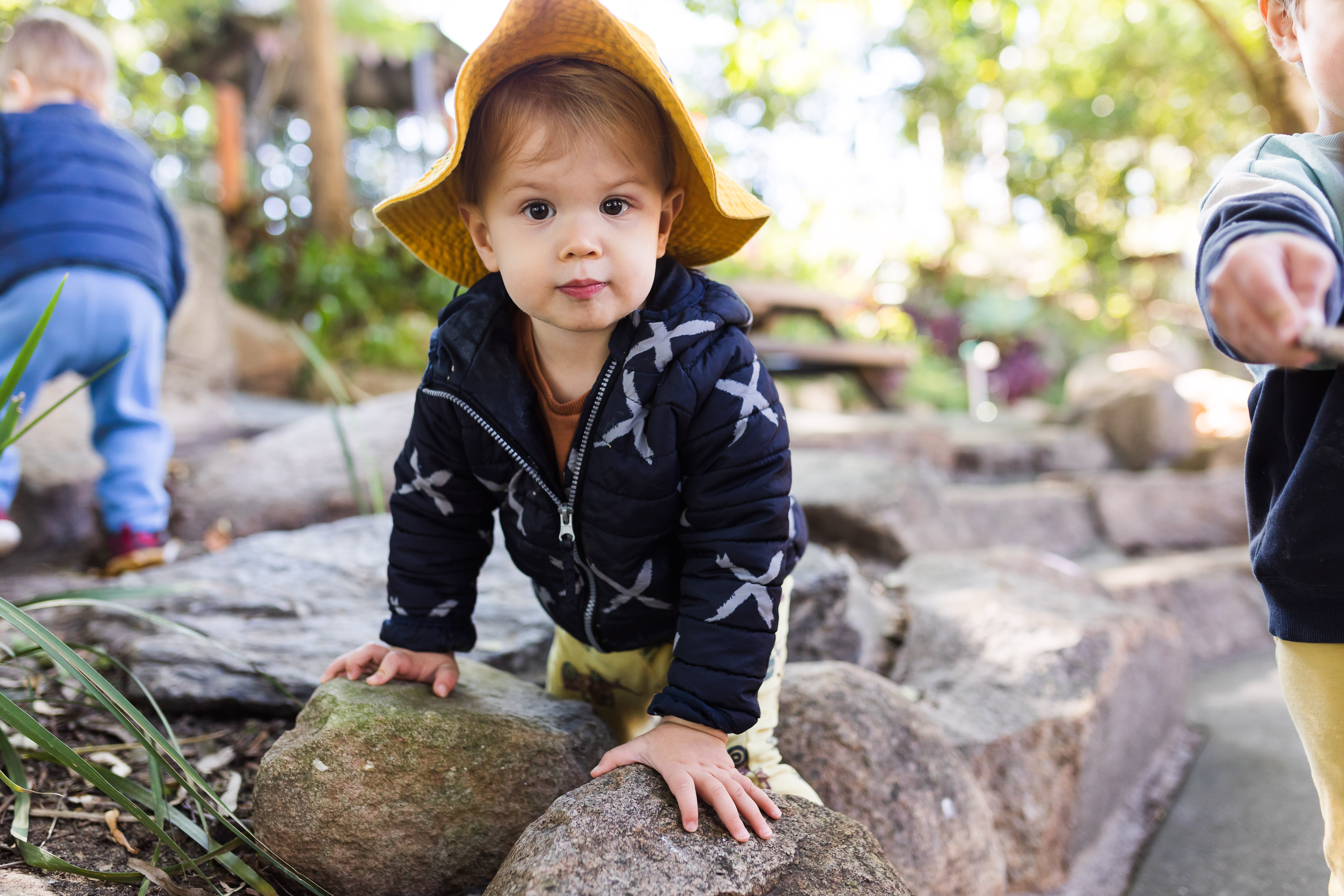 toddler climbing in outdoor area