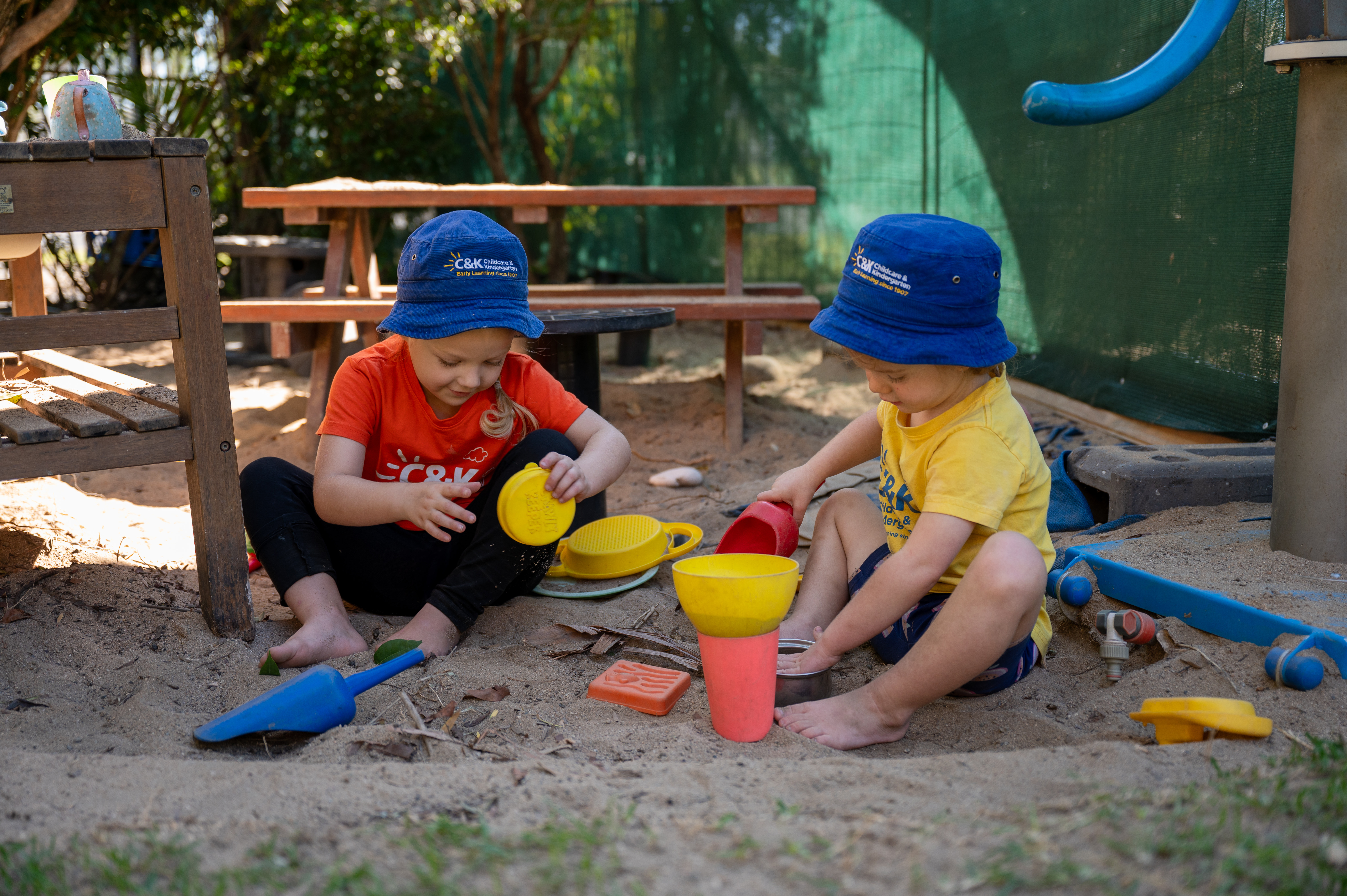 two children playing in sandpit