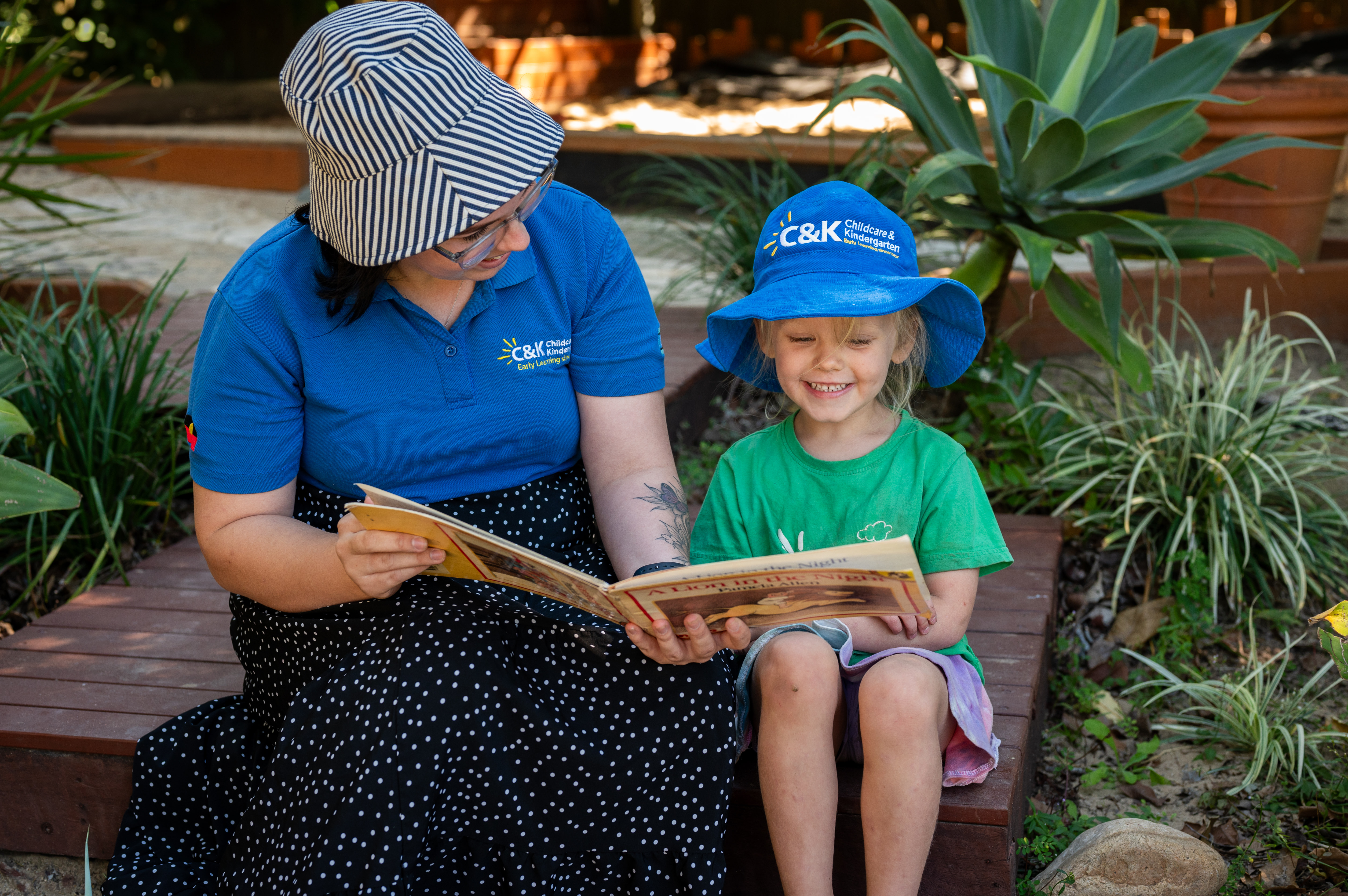 educator reading book to a child