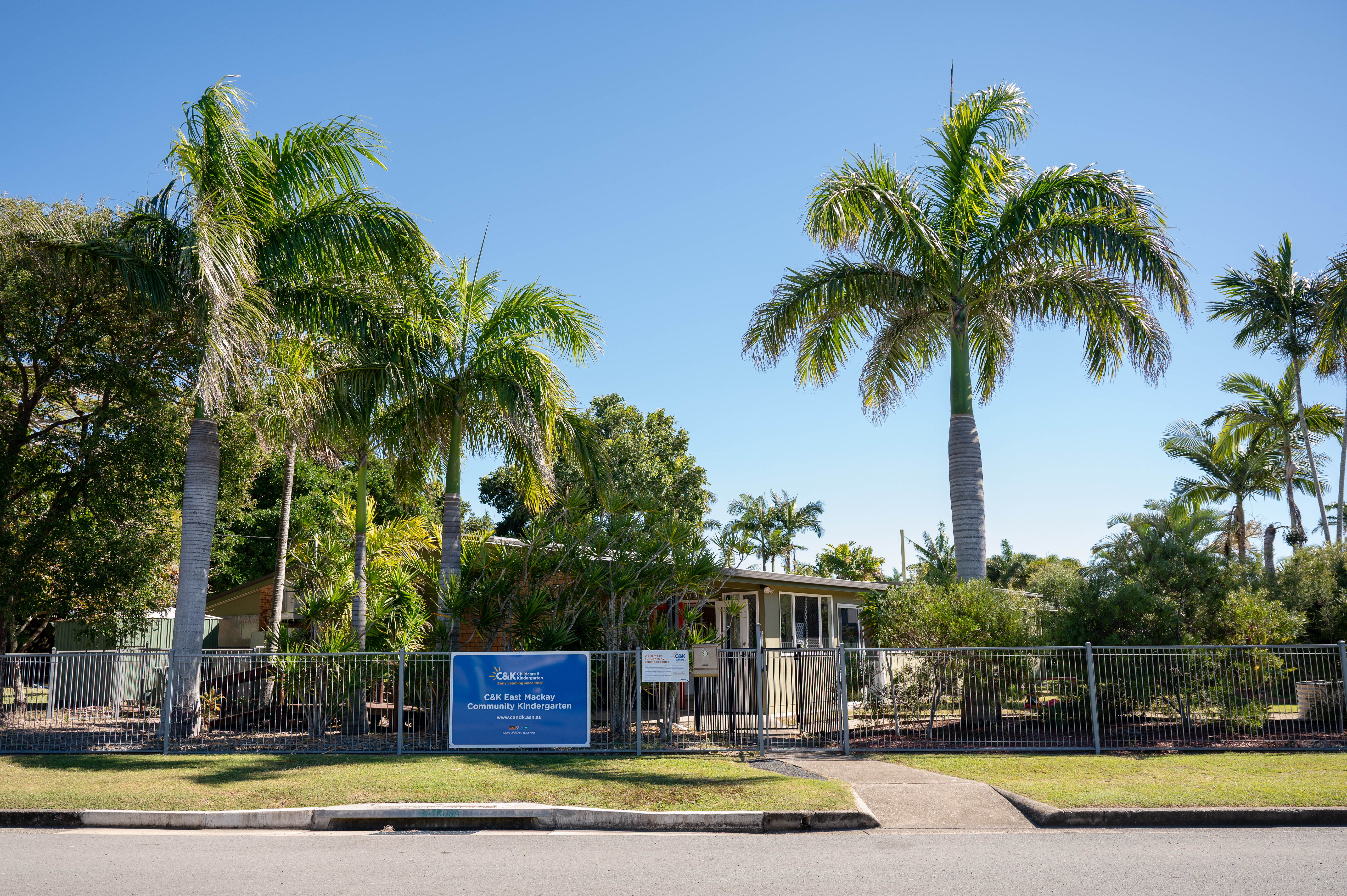 shot of kindergarten building including sign