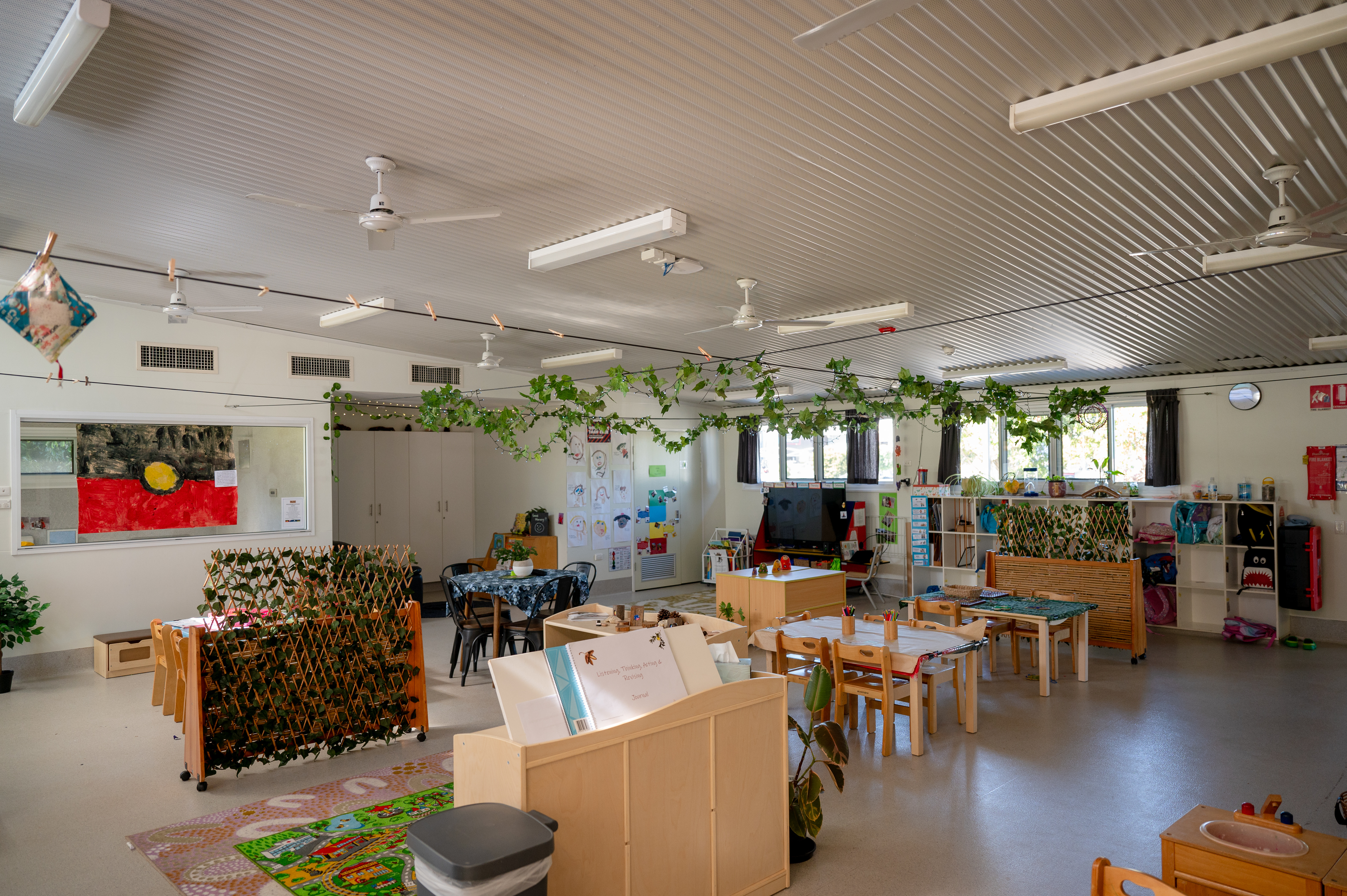 Inside kindergarten with artwork hanging