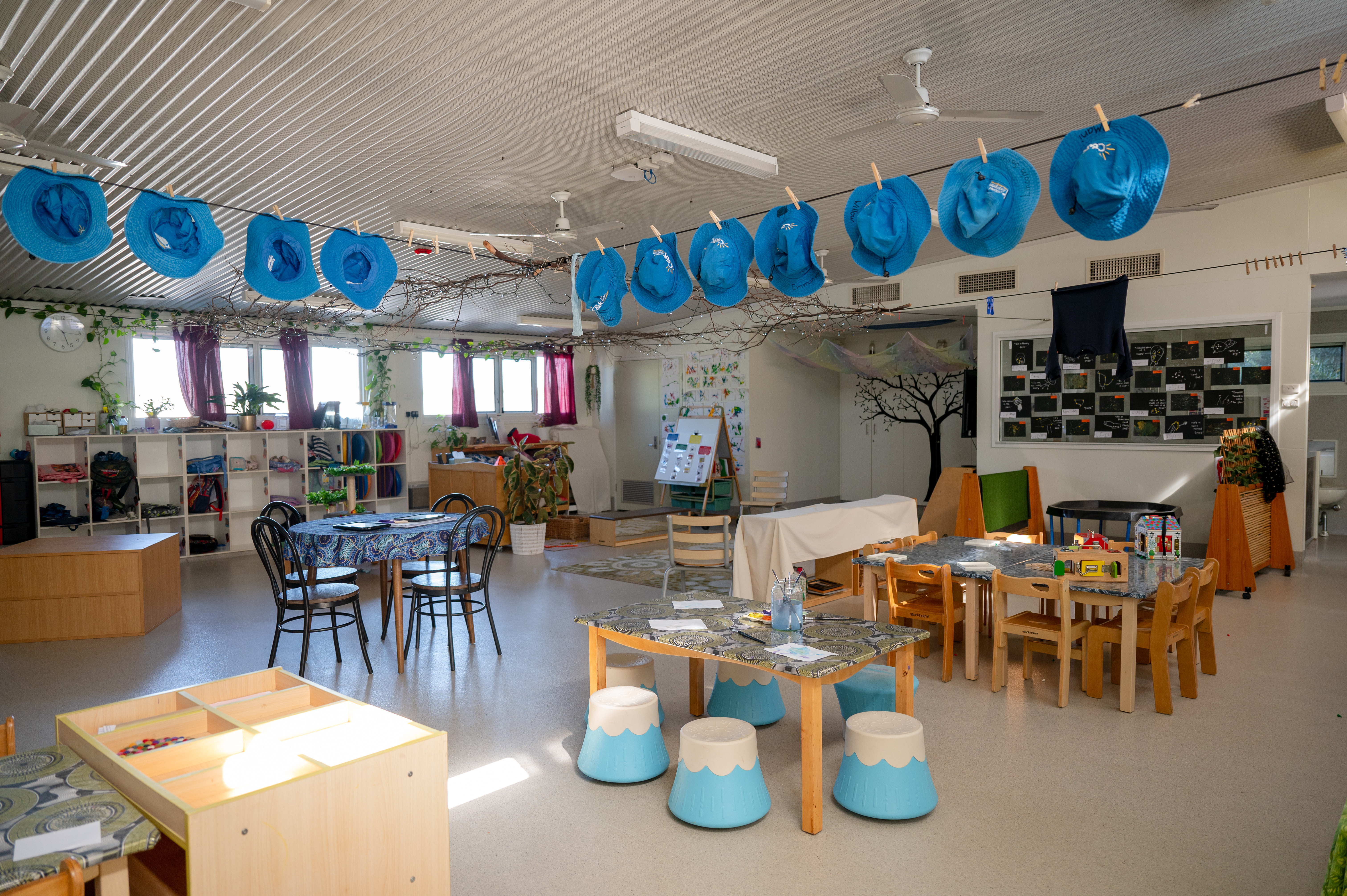Inside kindergarten with artwork hanging
