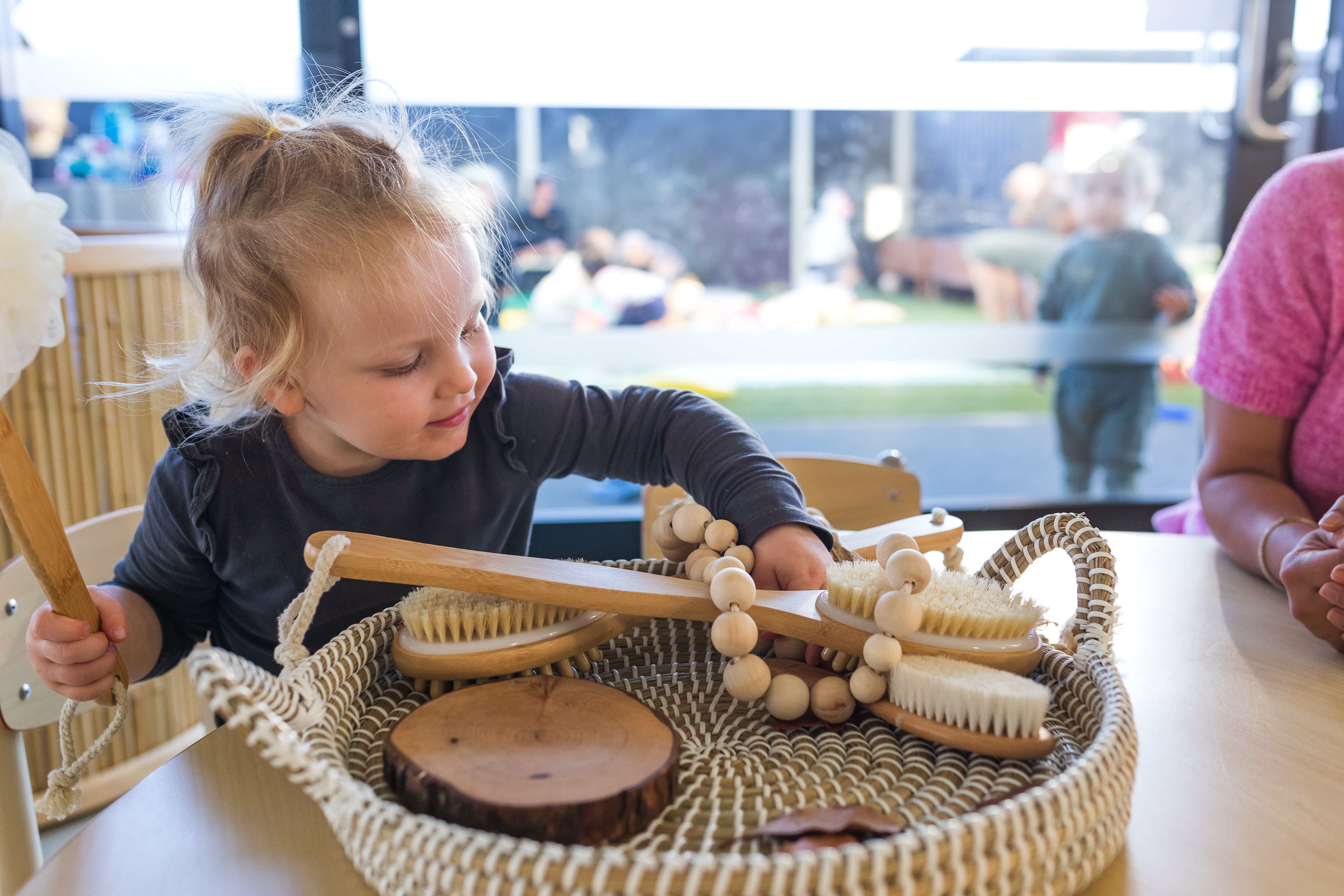 toddler playing with items inside