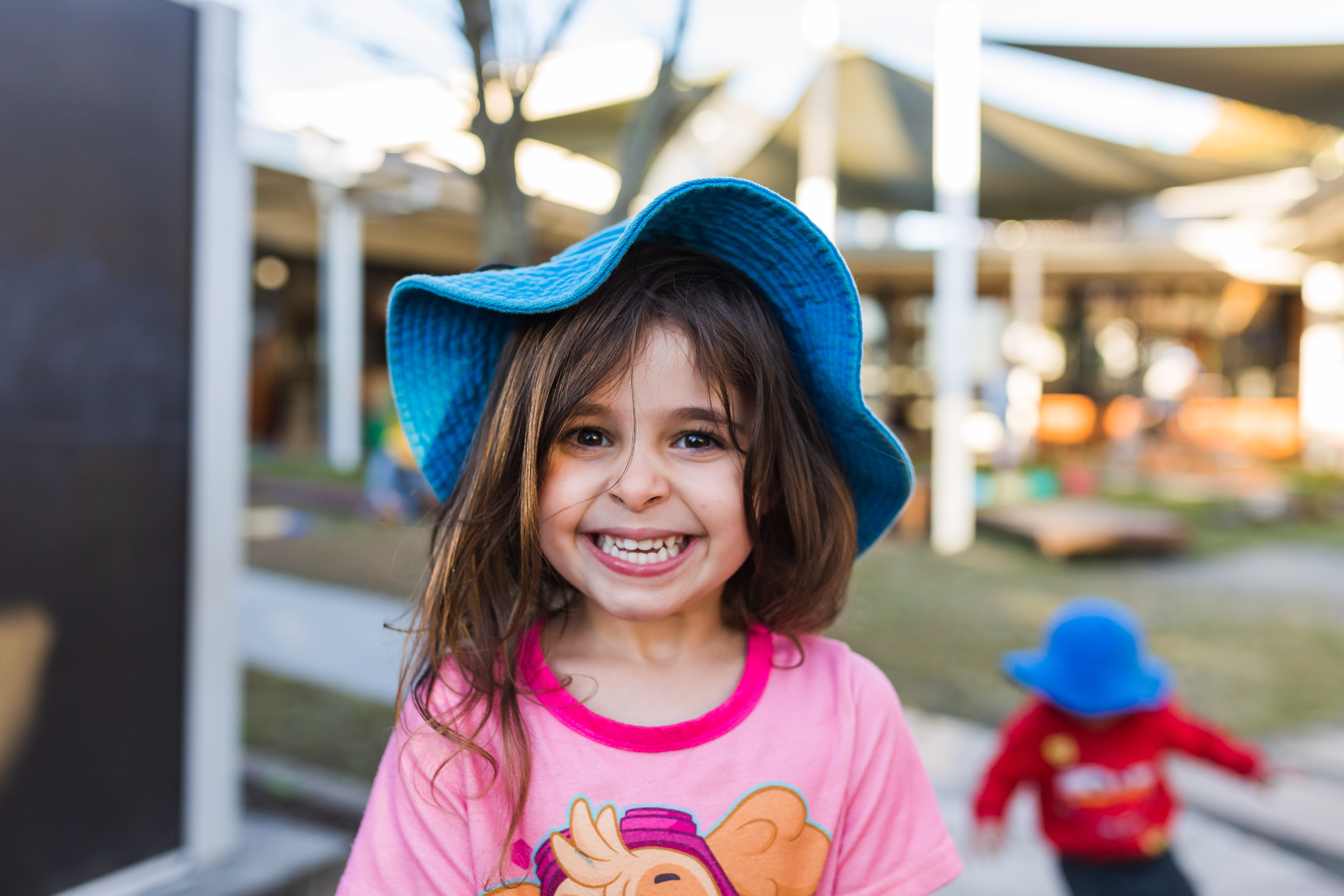 child outside smiling looking at camera