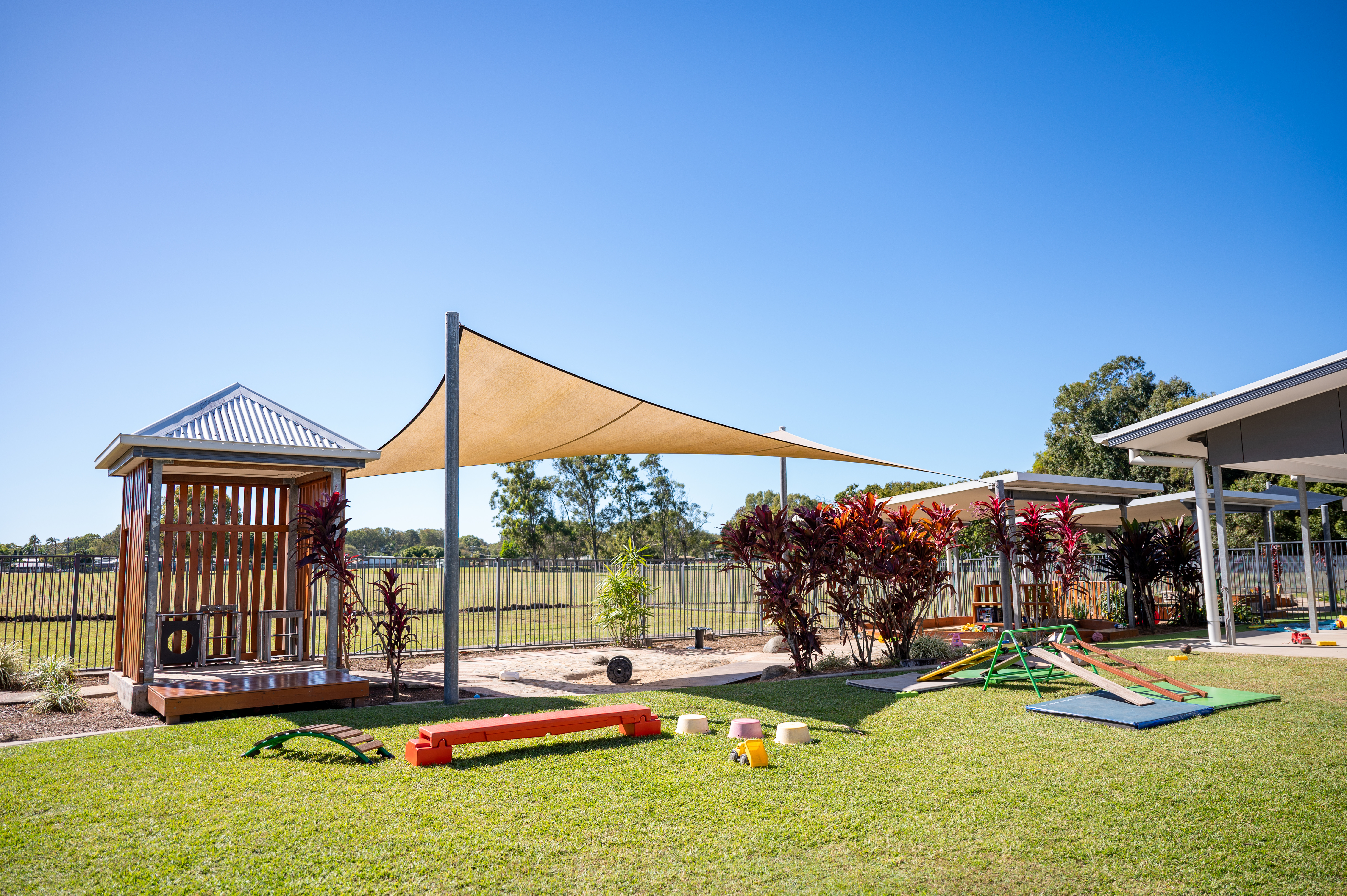Outdoor area with obstacle course and deck