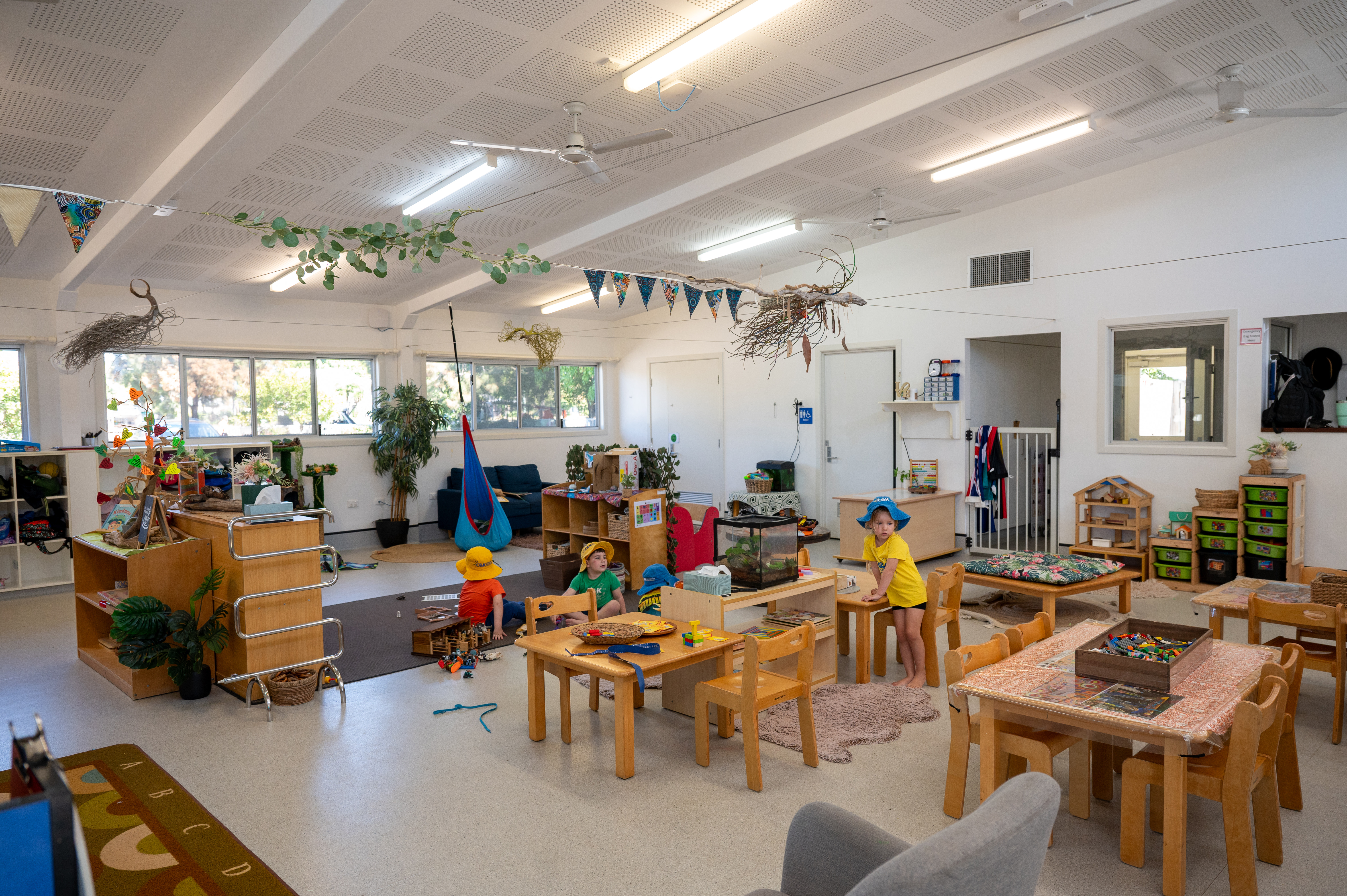 inside kindergarten with children playing 