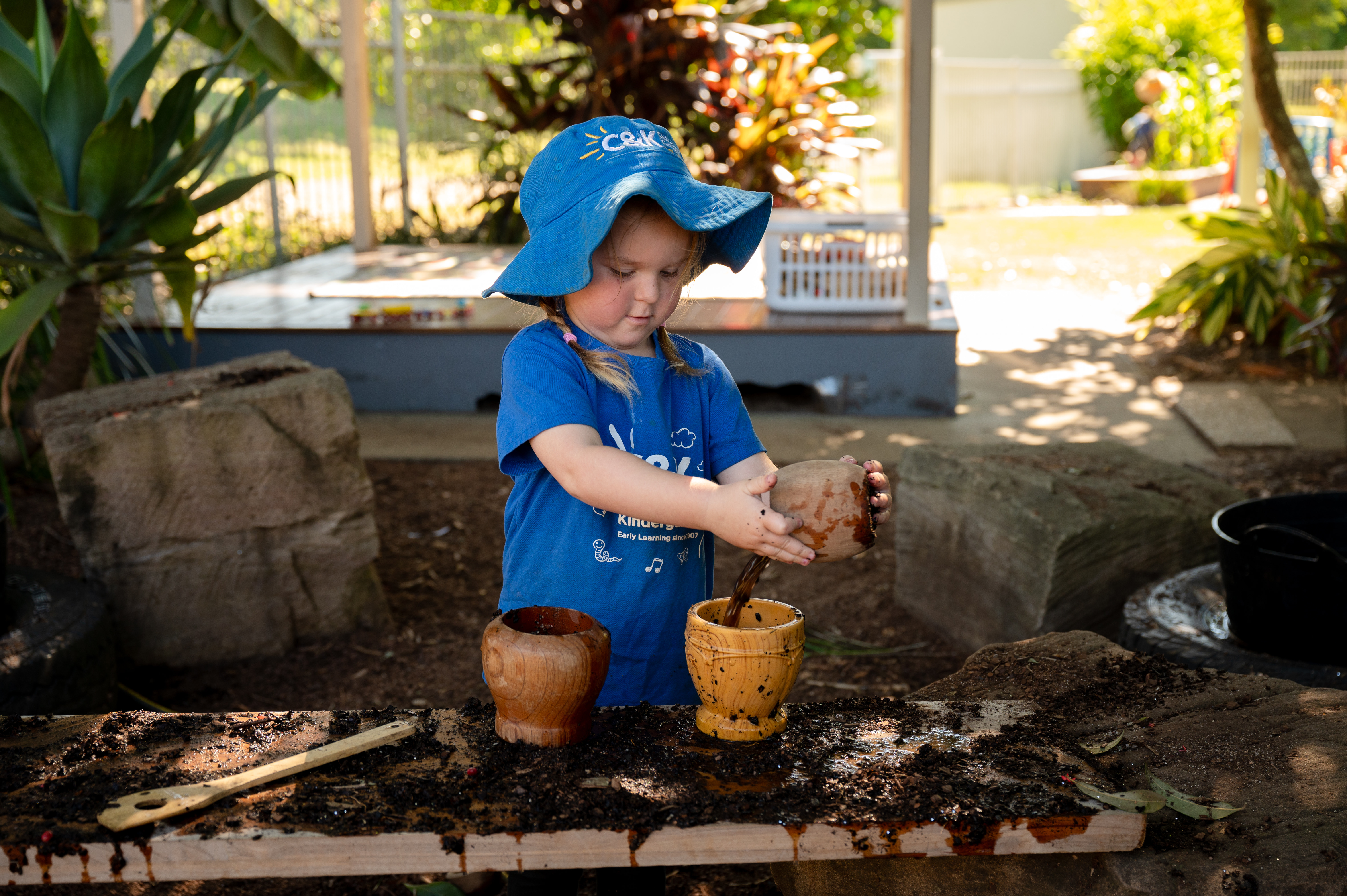 child playing in mud