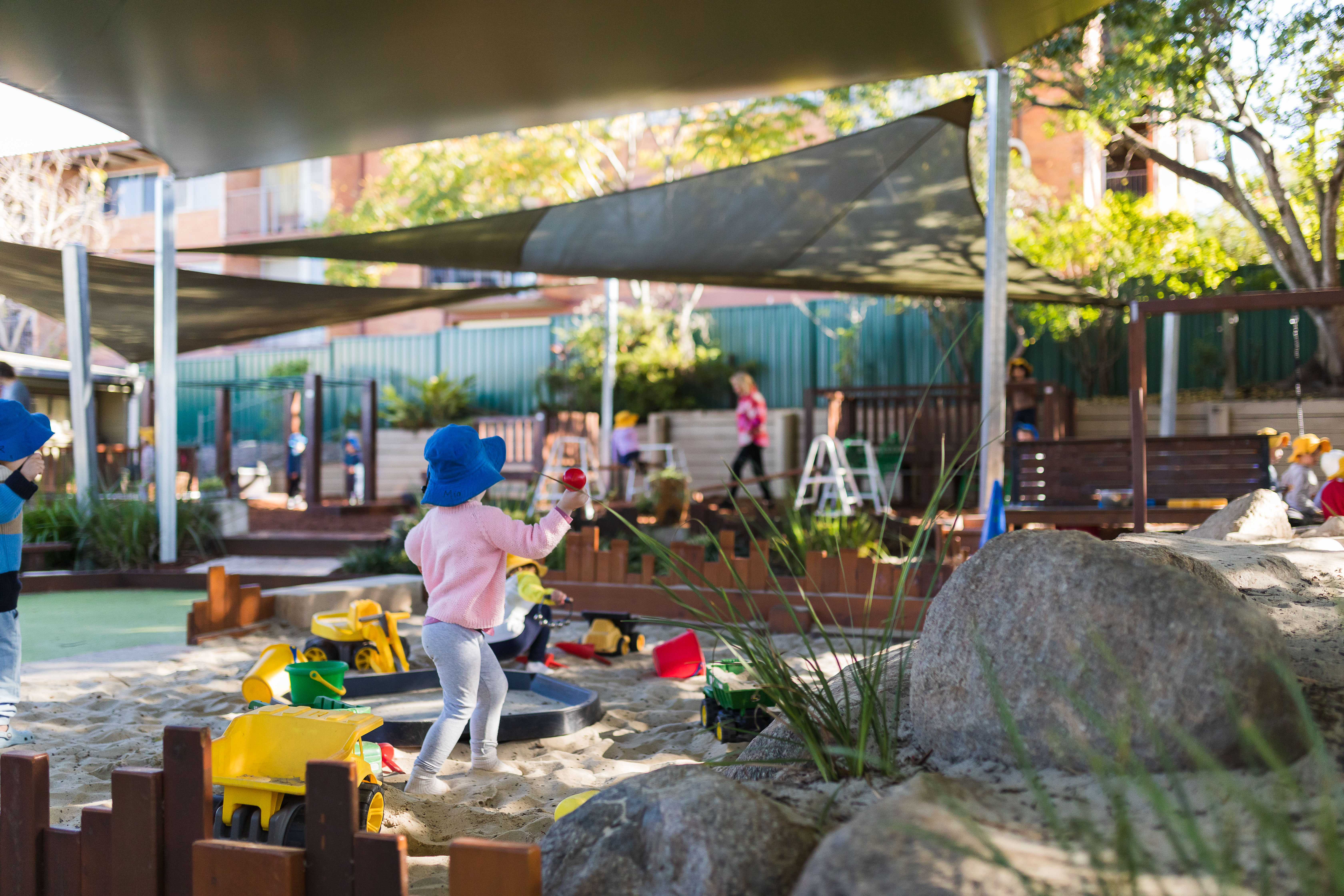 children playing in sandpit