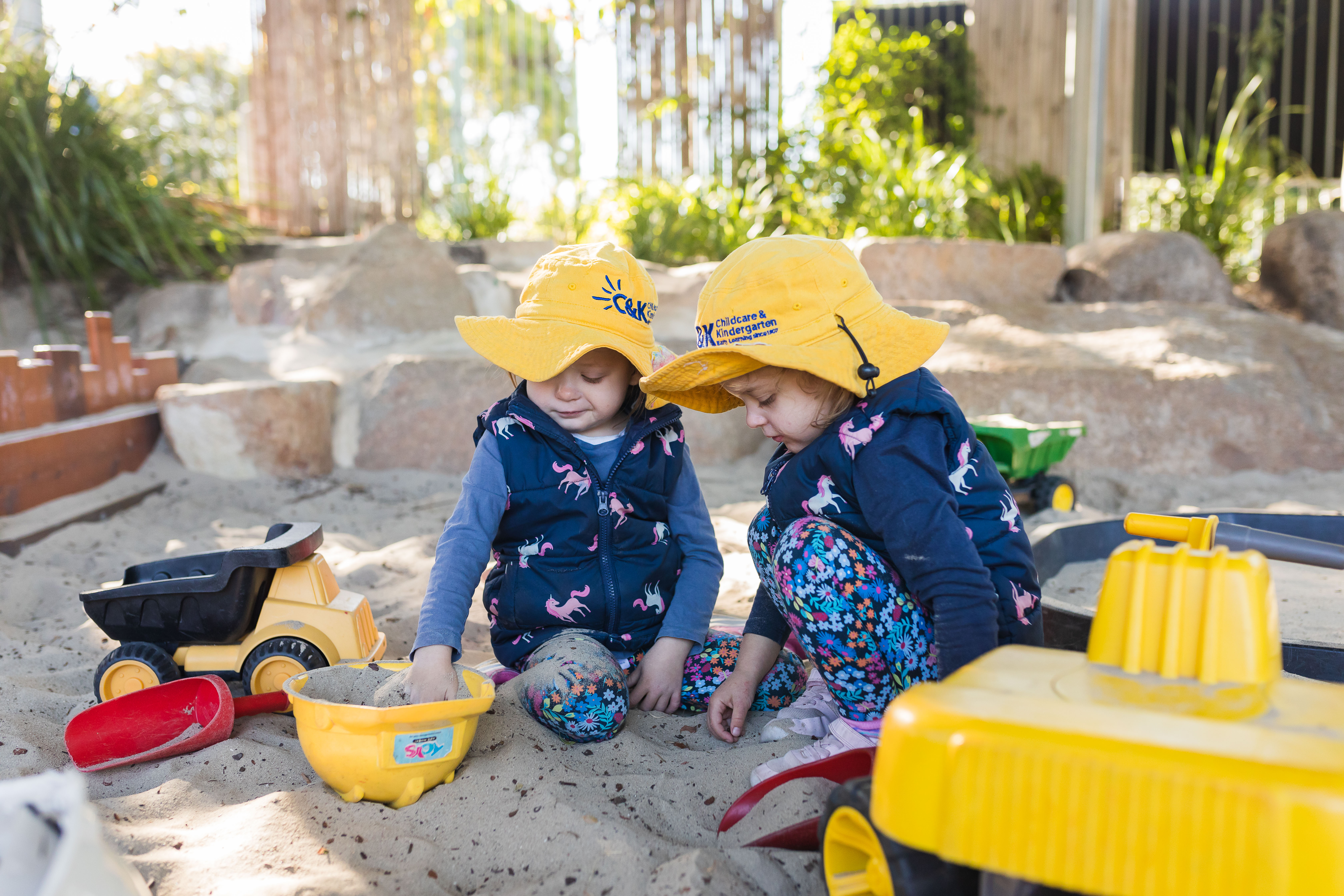 two children playing in sandpit