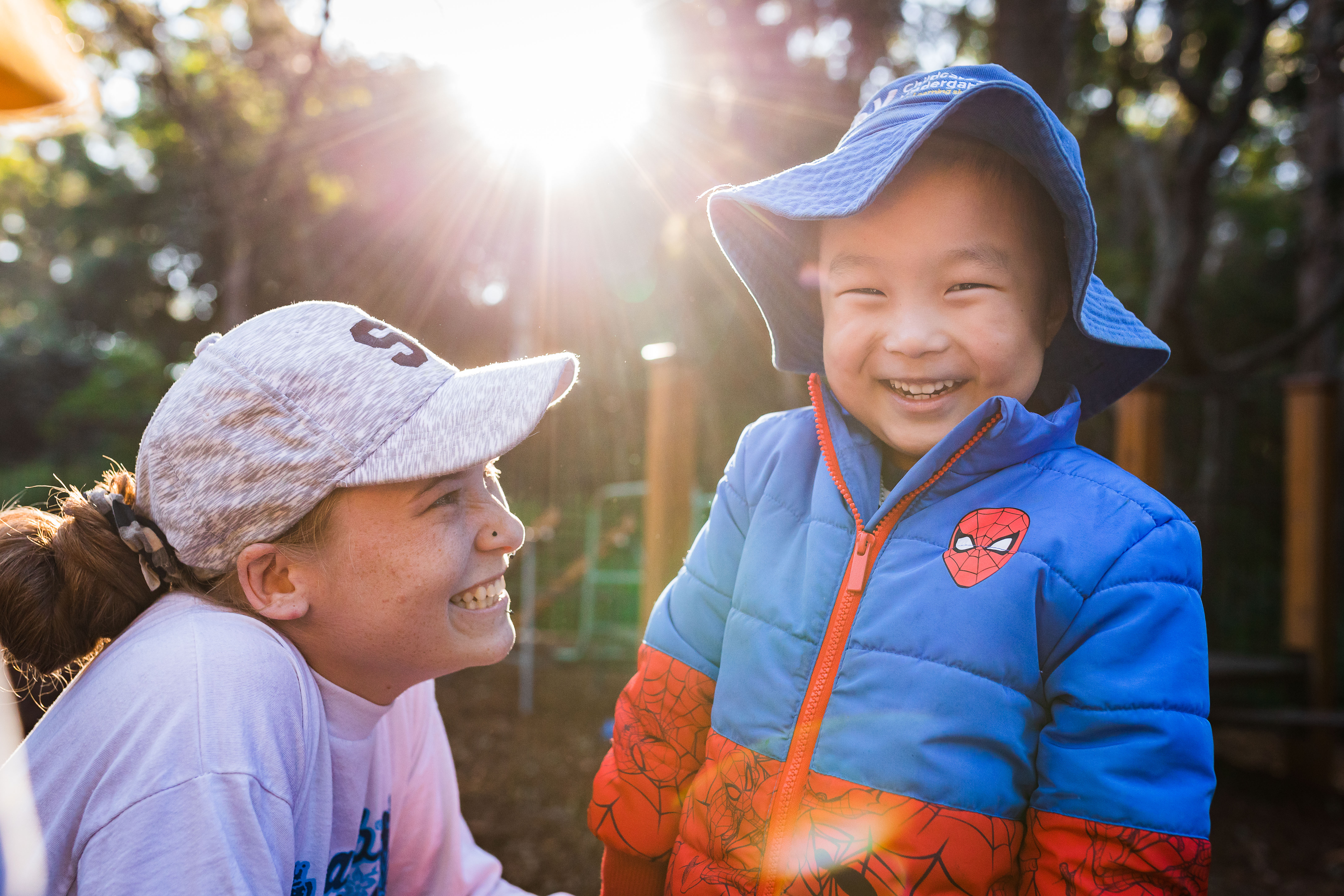 Educator and child together outside