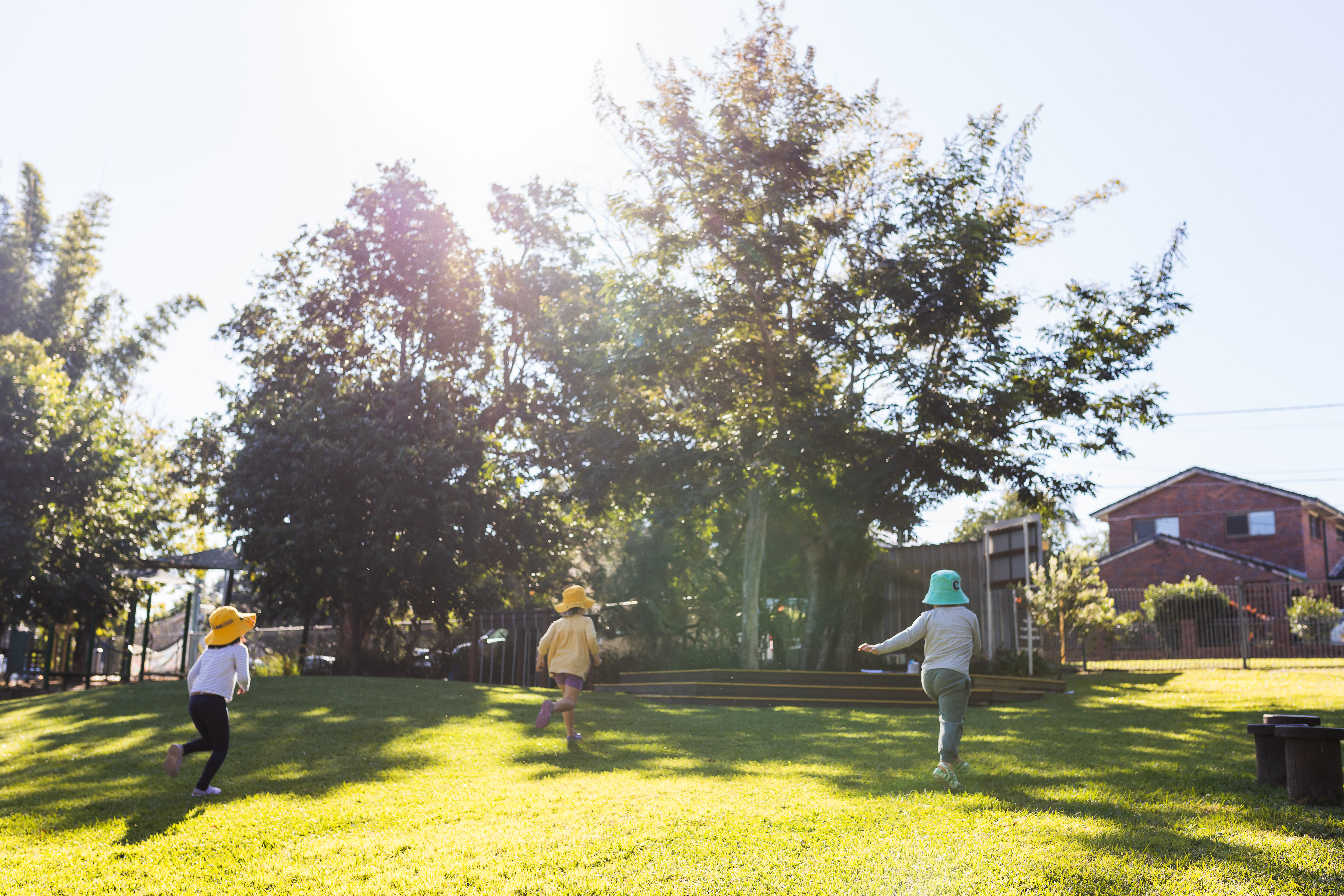 children running on grass