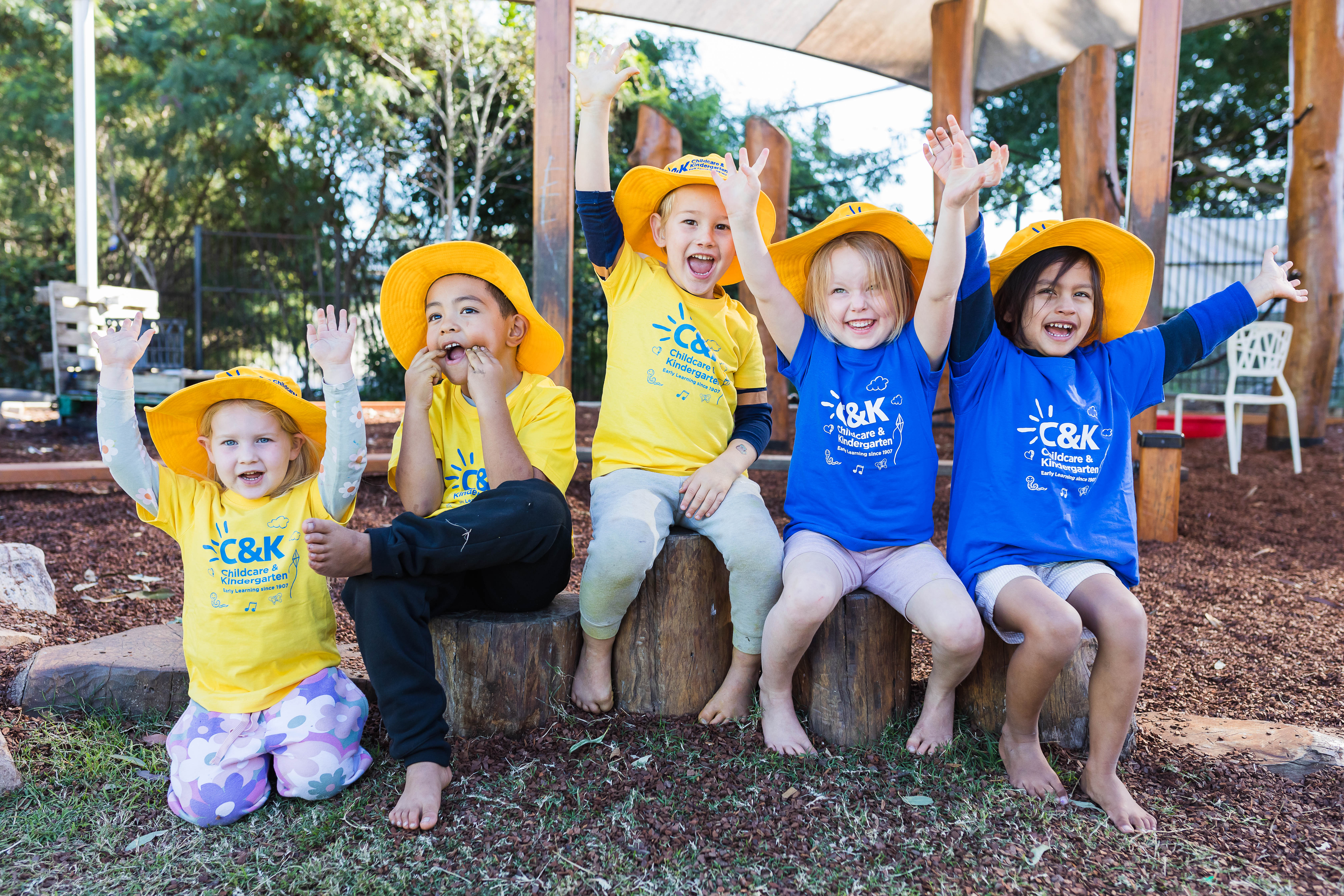 children together outside smiling