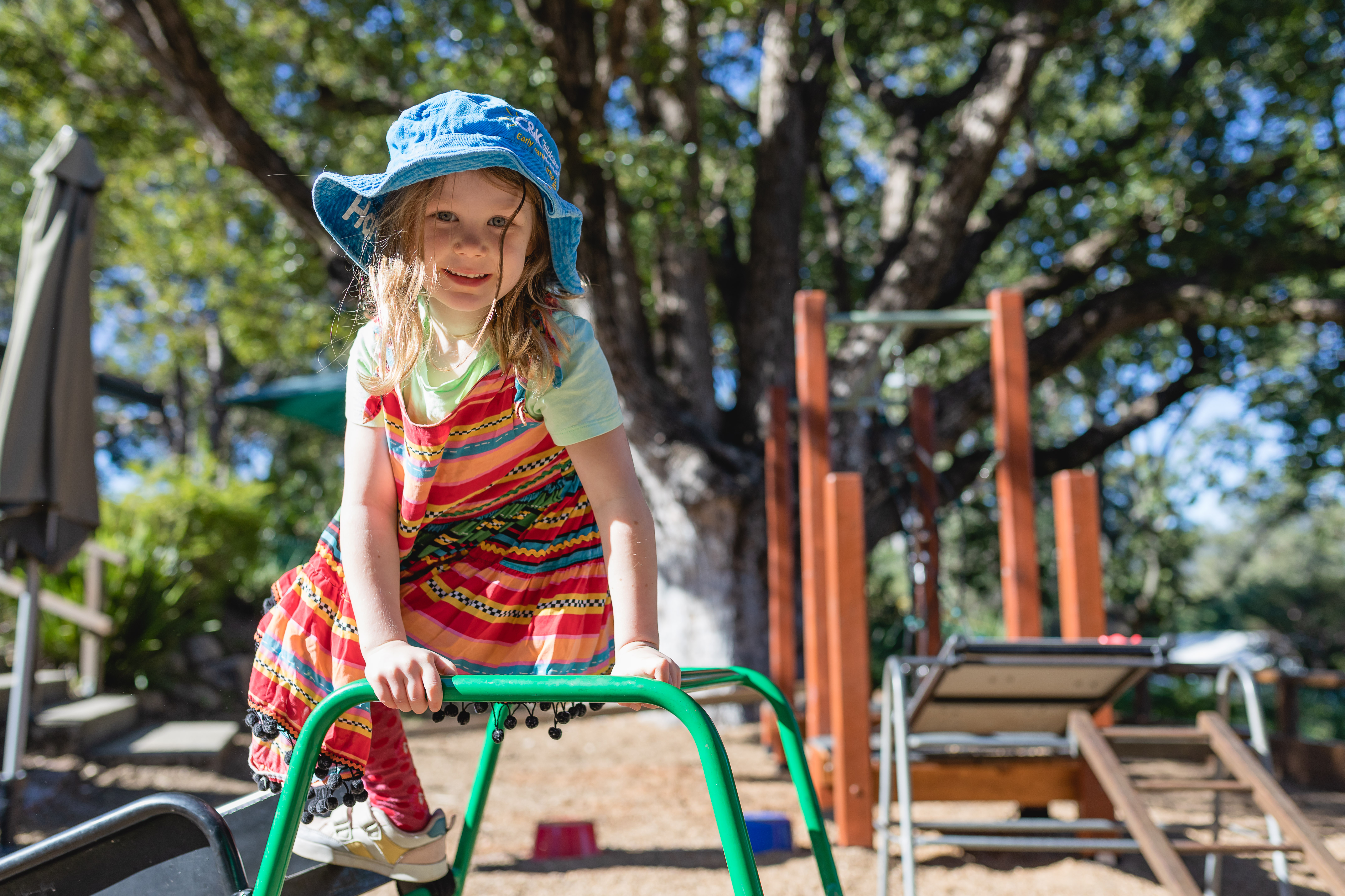 child smiling on obstacle course