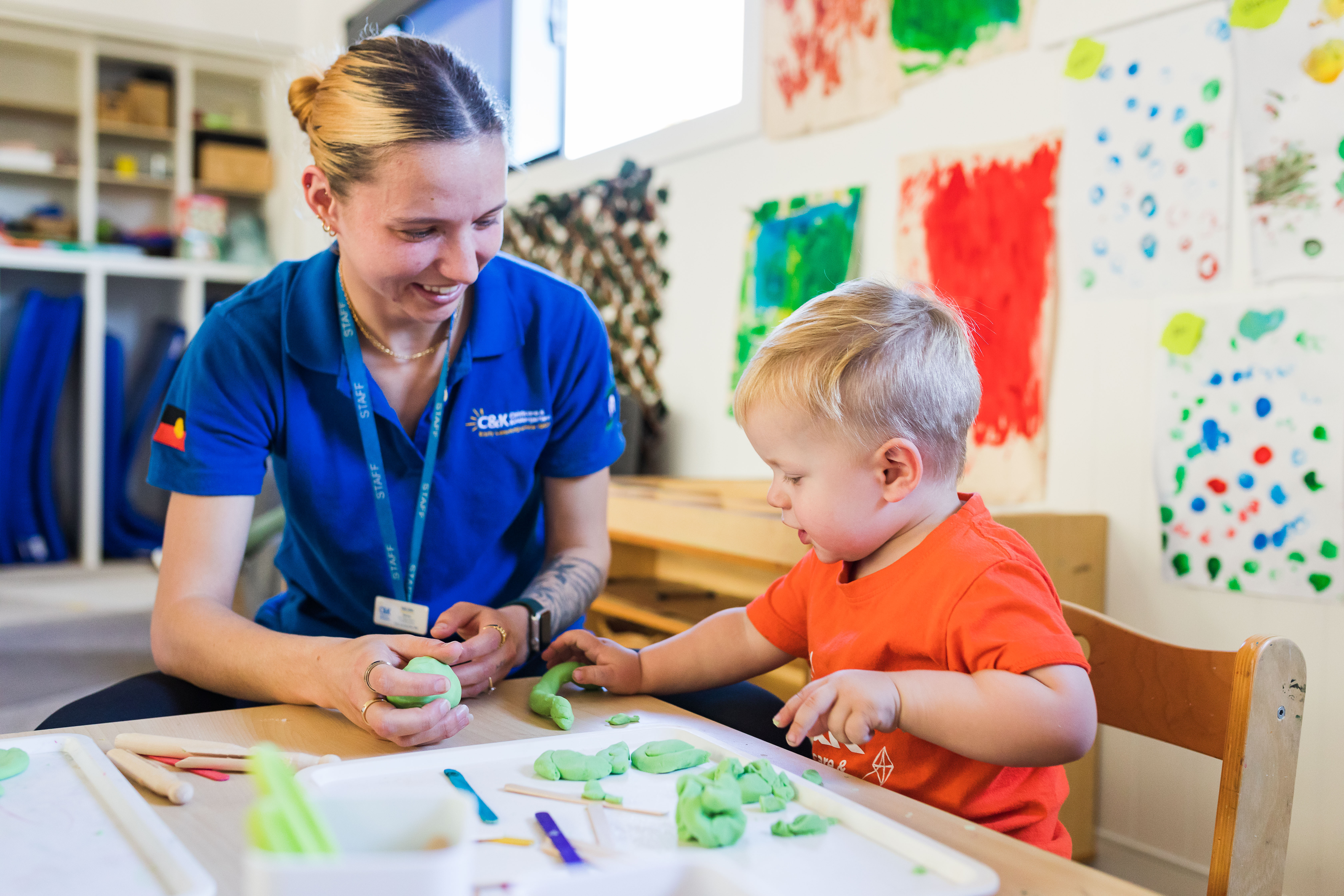 educator and toddler together