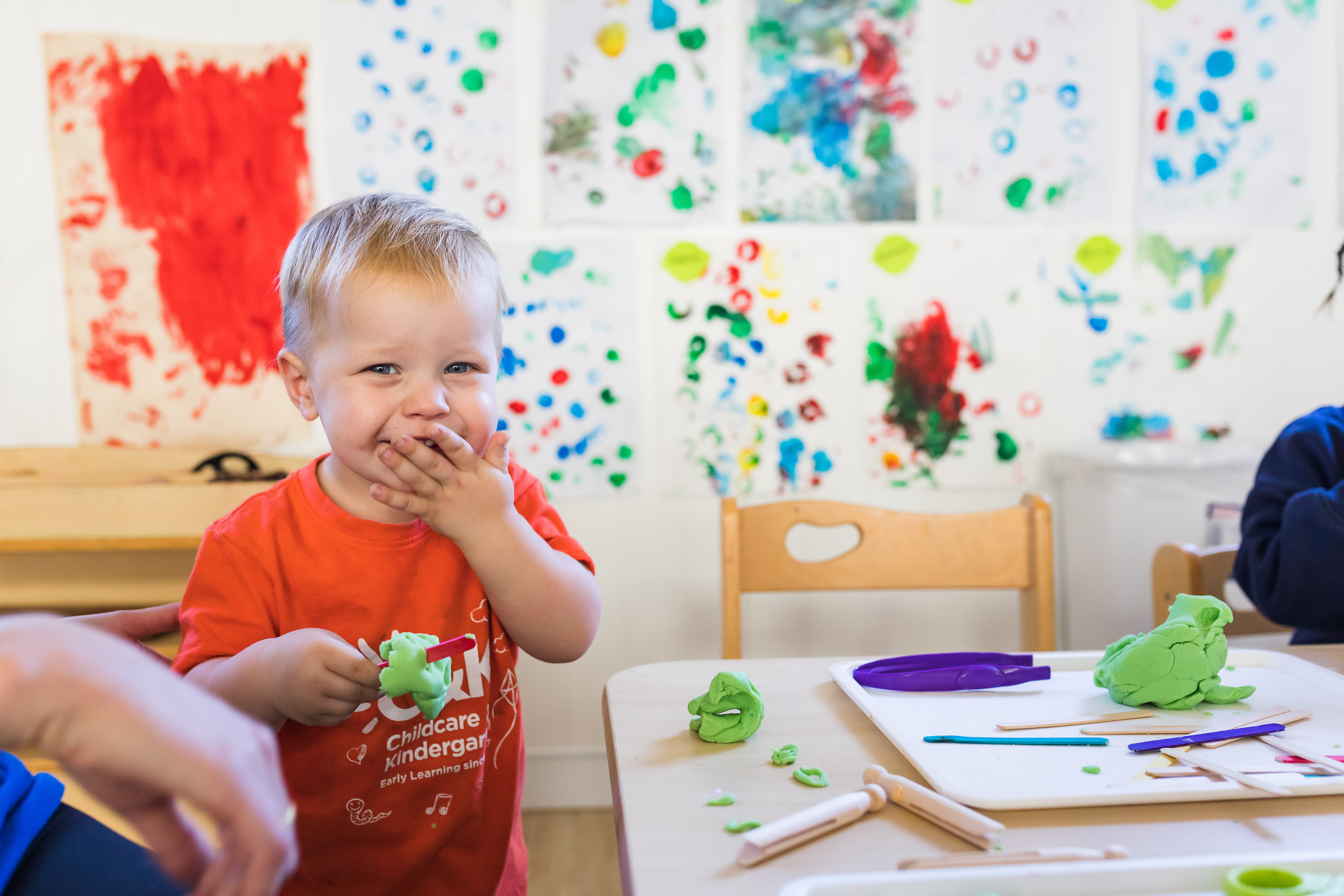 toddler smiling playing