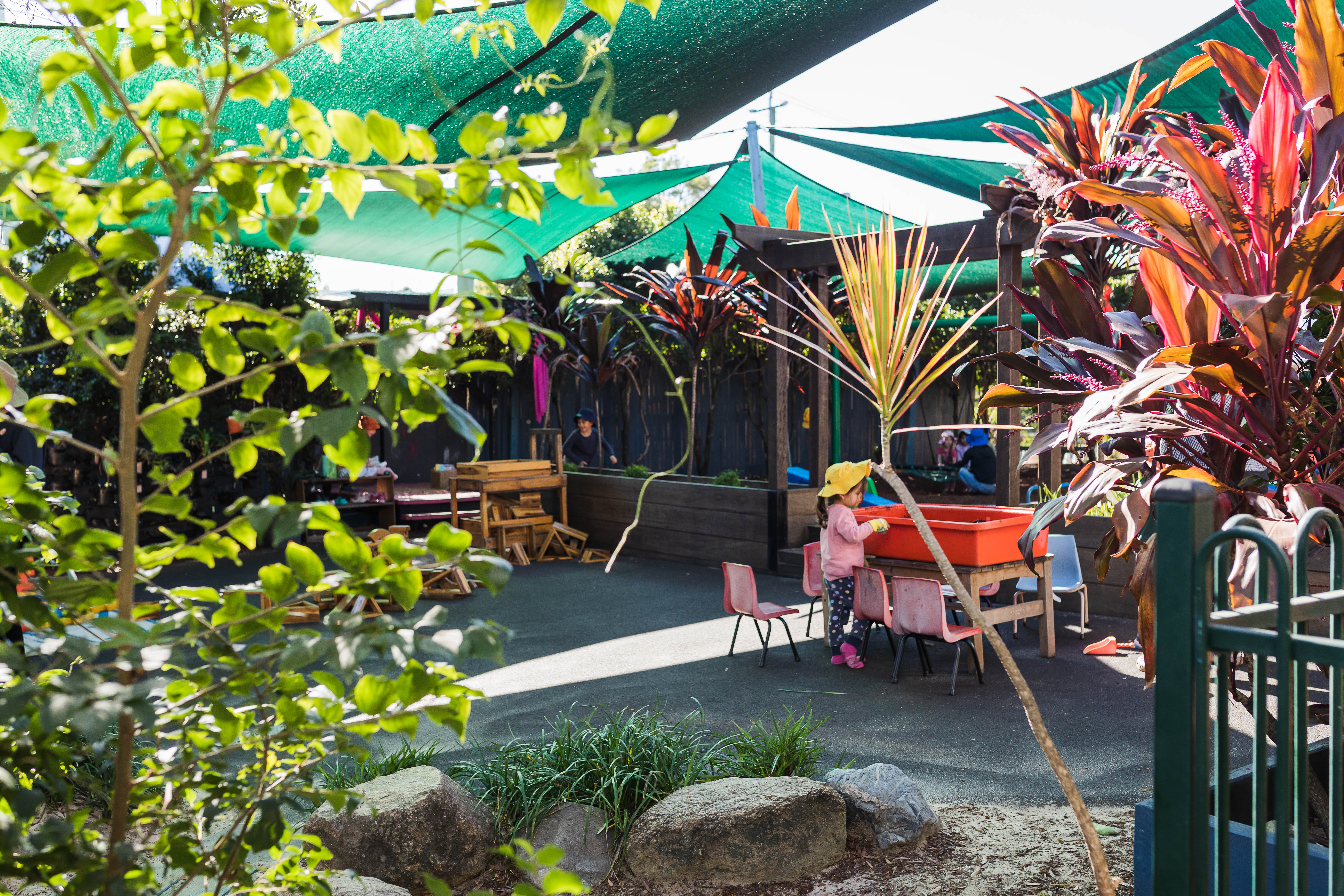 playground amongst lush garden