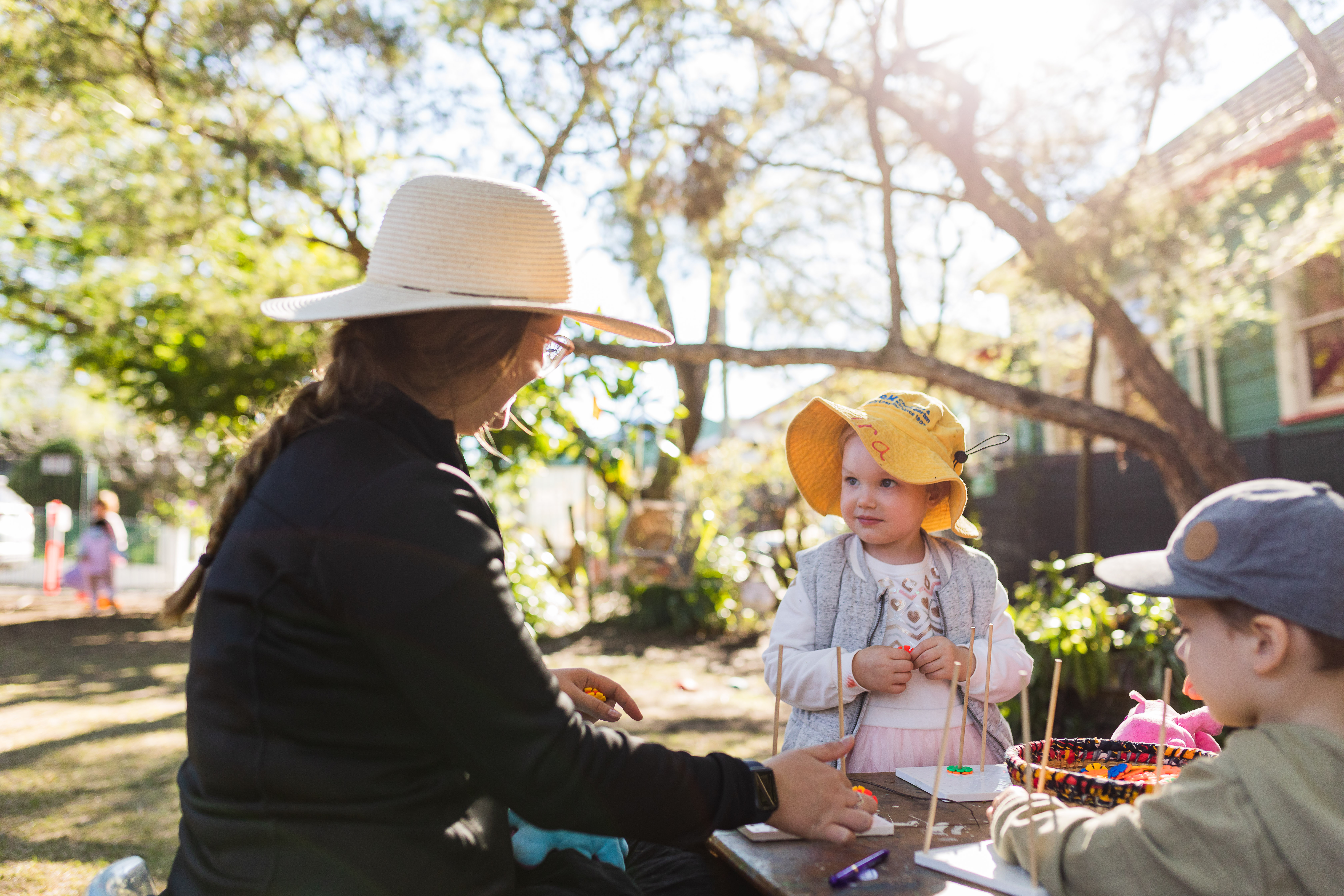 Educators and children outside playing