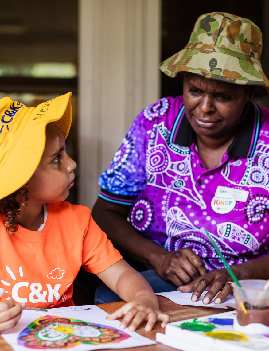 Support staff and kindy child painting