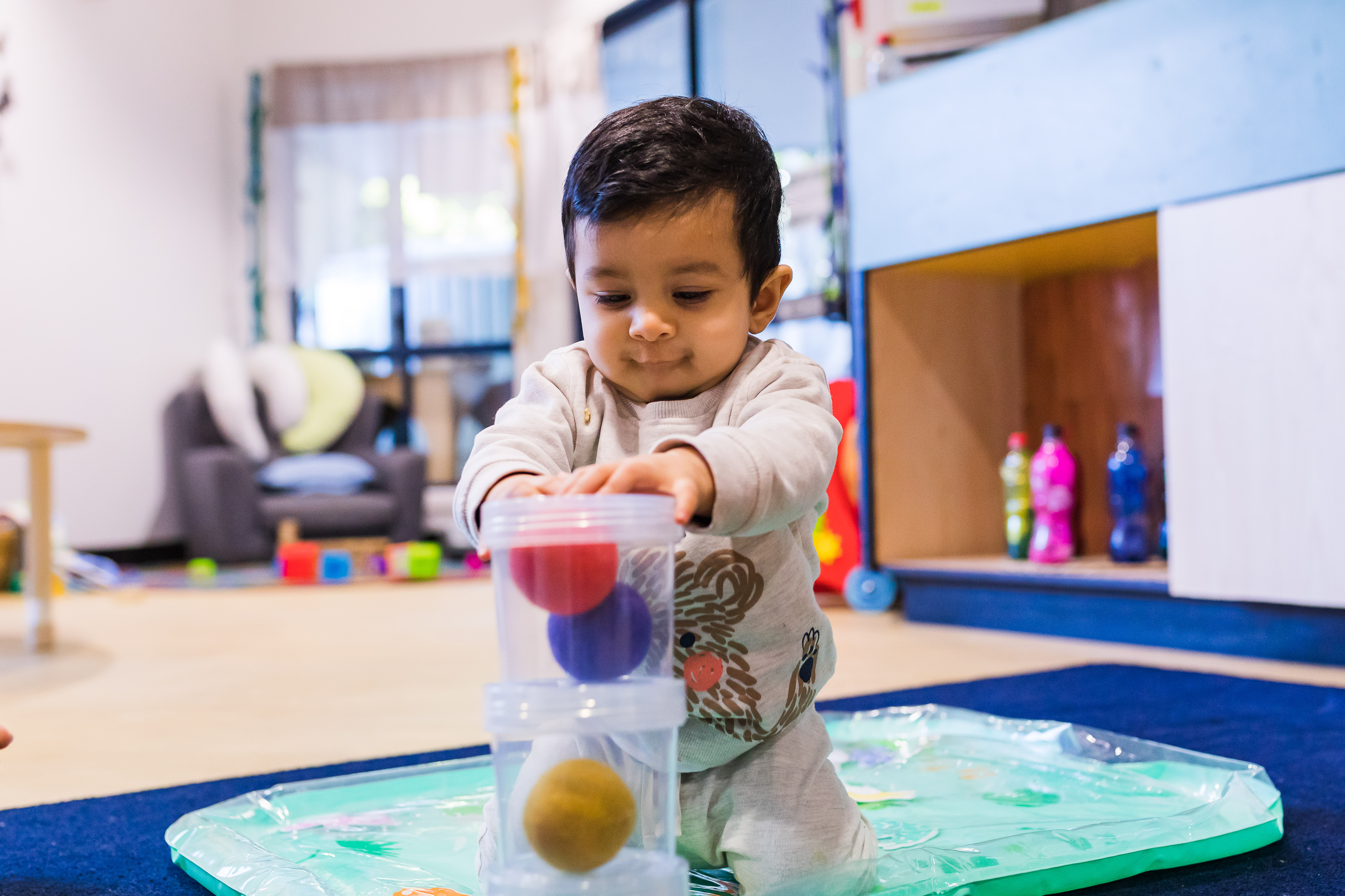 Baby playing with engaging toys
