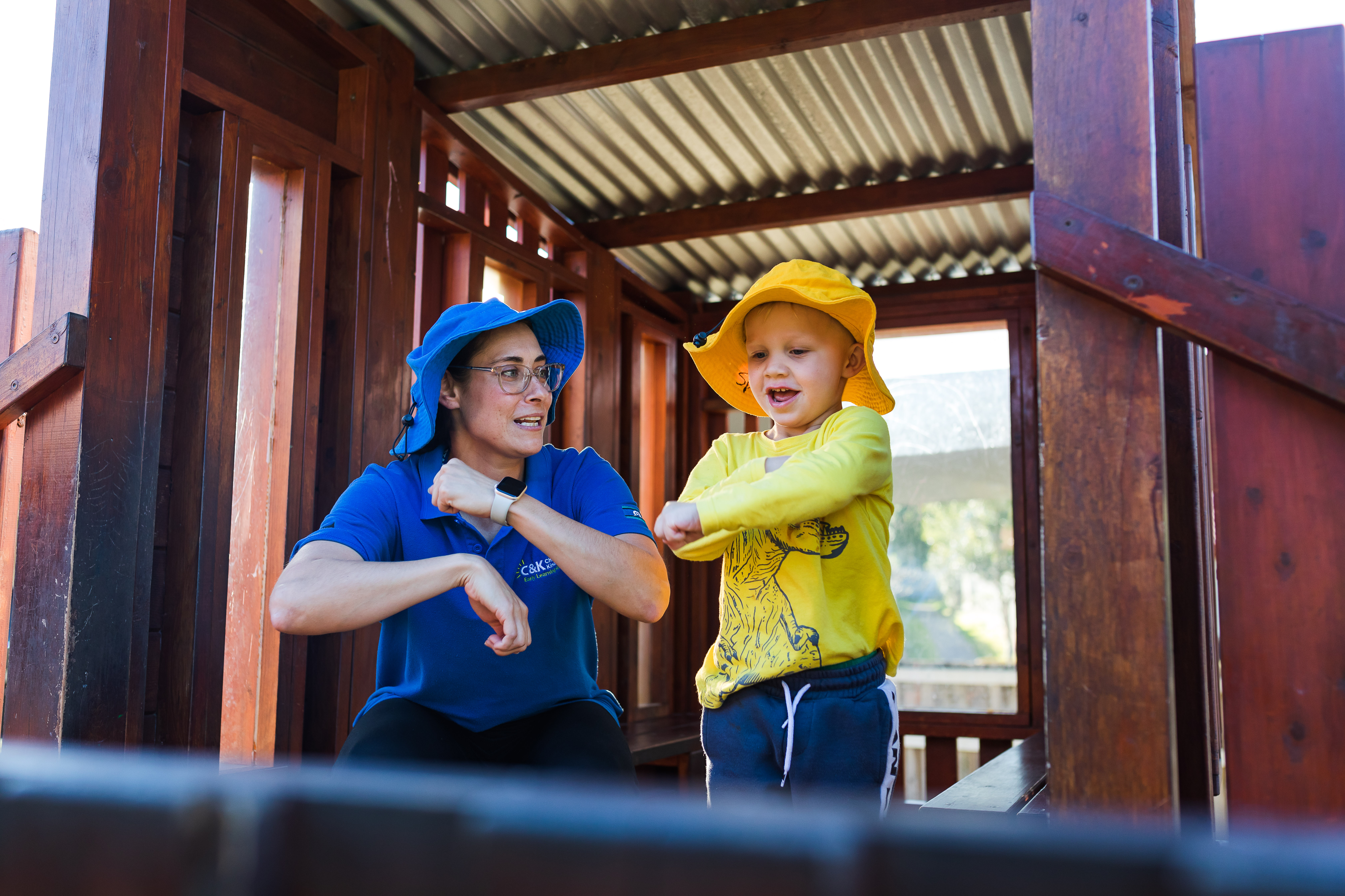 Educator and child playing