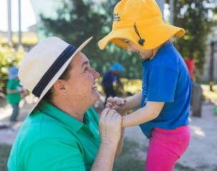 C&K College Educator and Child smiling at each other - Micro-credentials