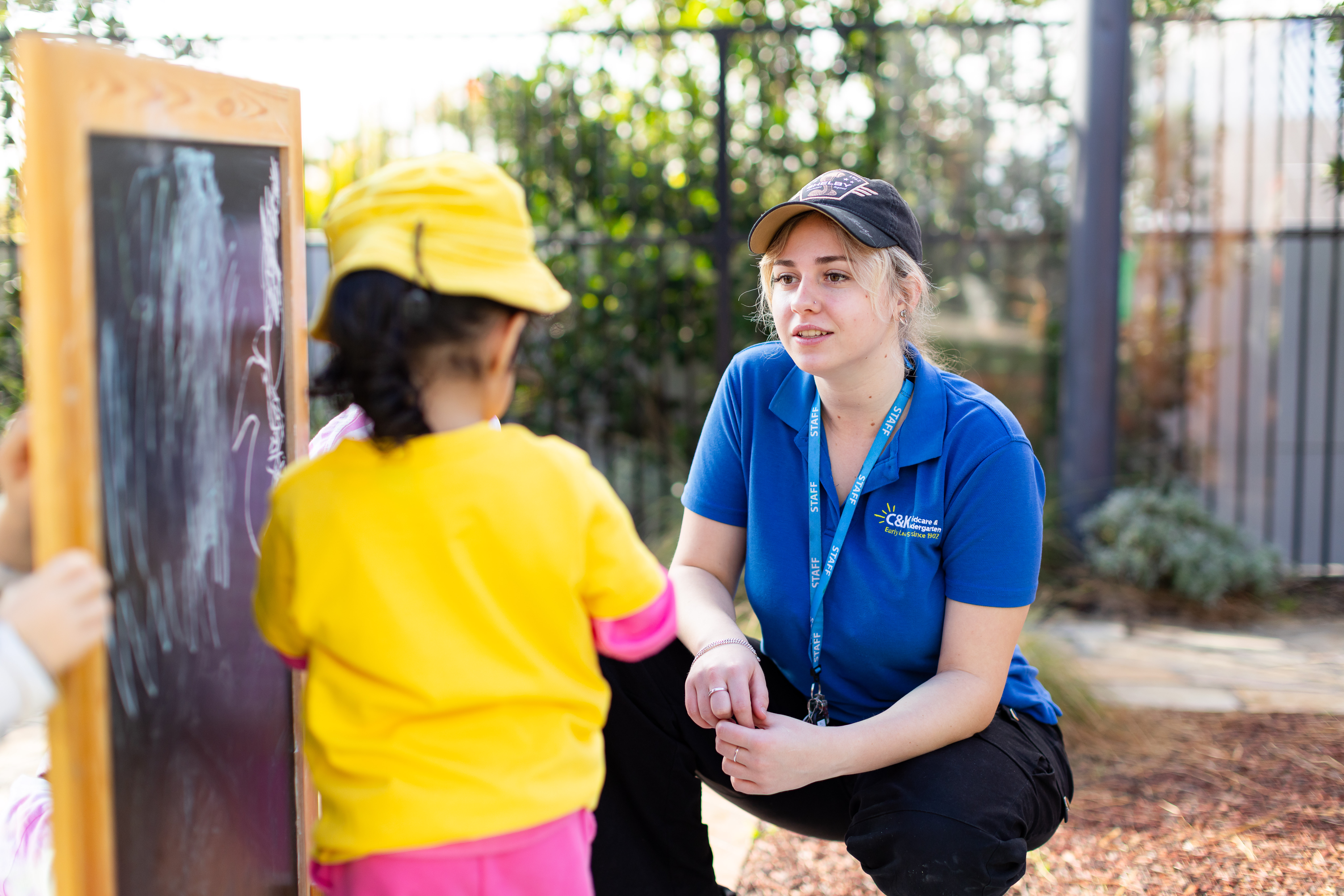 Educator smiling with kindy child