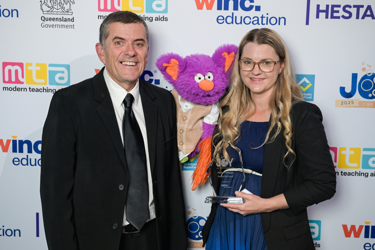Natalie McDougall and Edgar from C&K Slade Point kindy winning their award