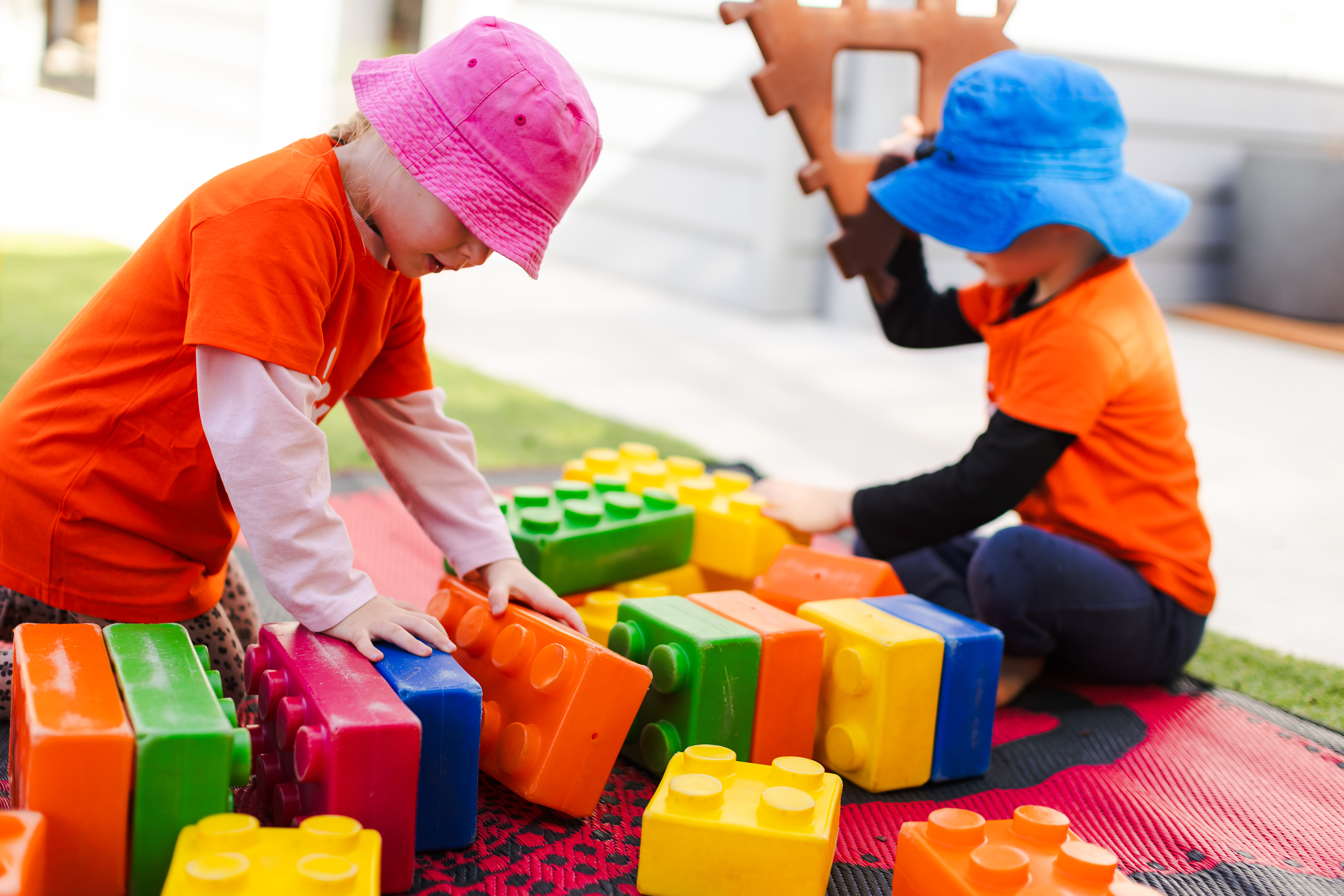 Two children playing with blocks