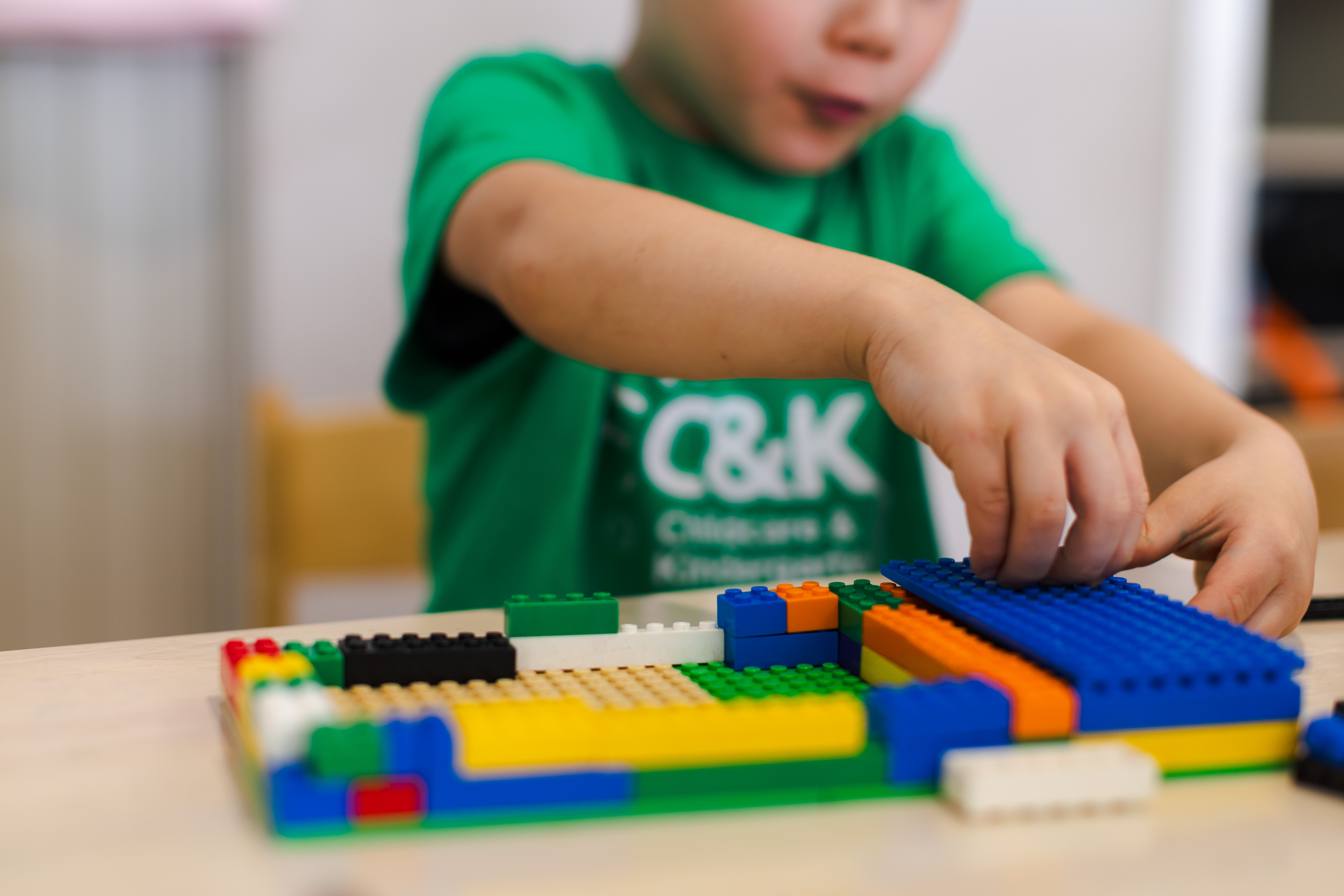 Child playing with LEGO