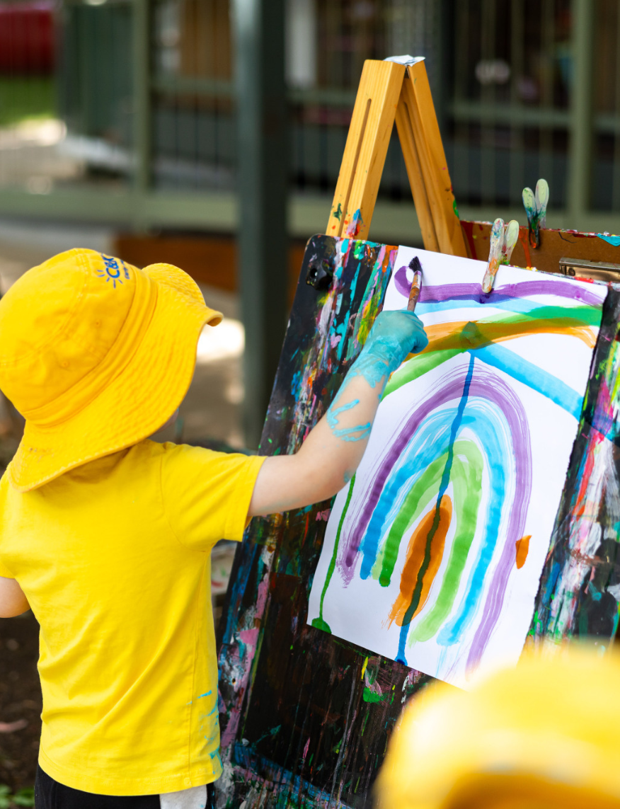 Child painting outside