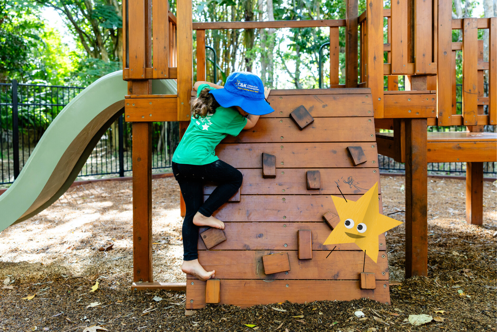 Child climbing the playground with one of the Open Week Papermates