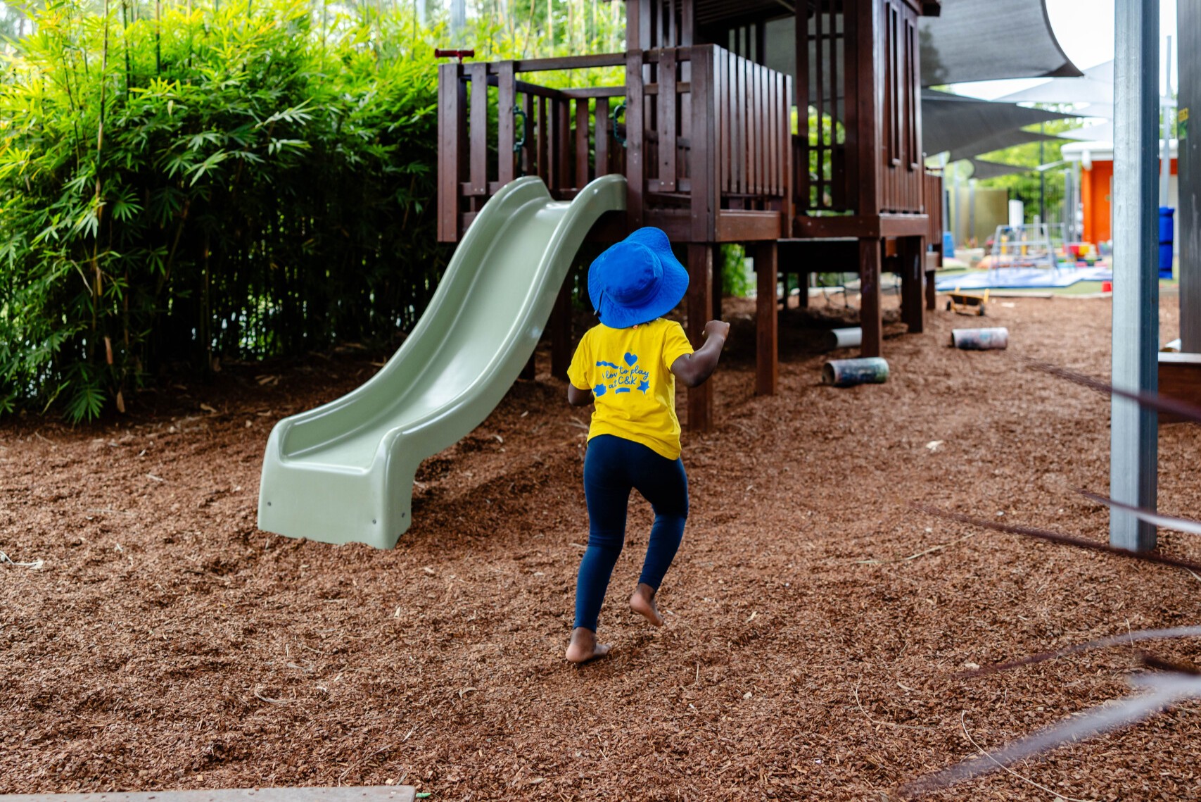 Girl running through a playground