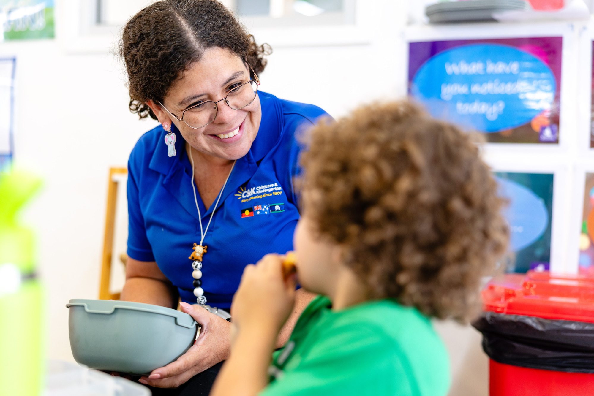 Educator and Child smiling at each other - Micro-credentials