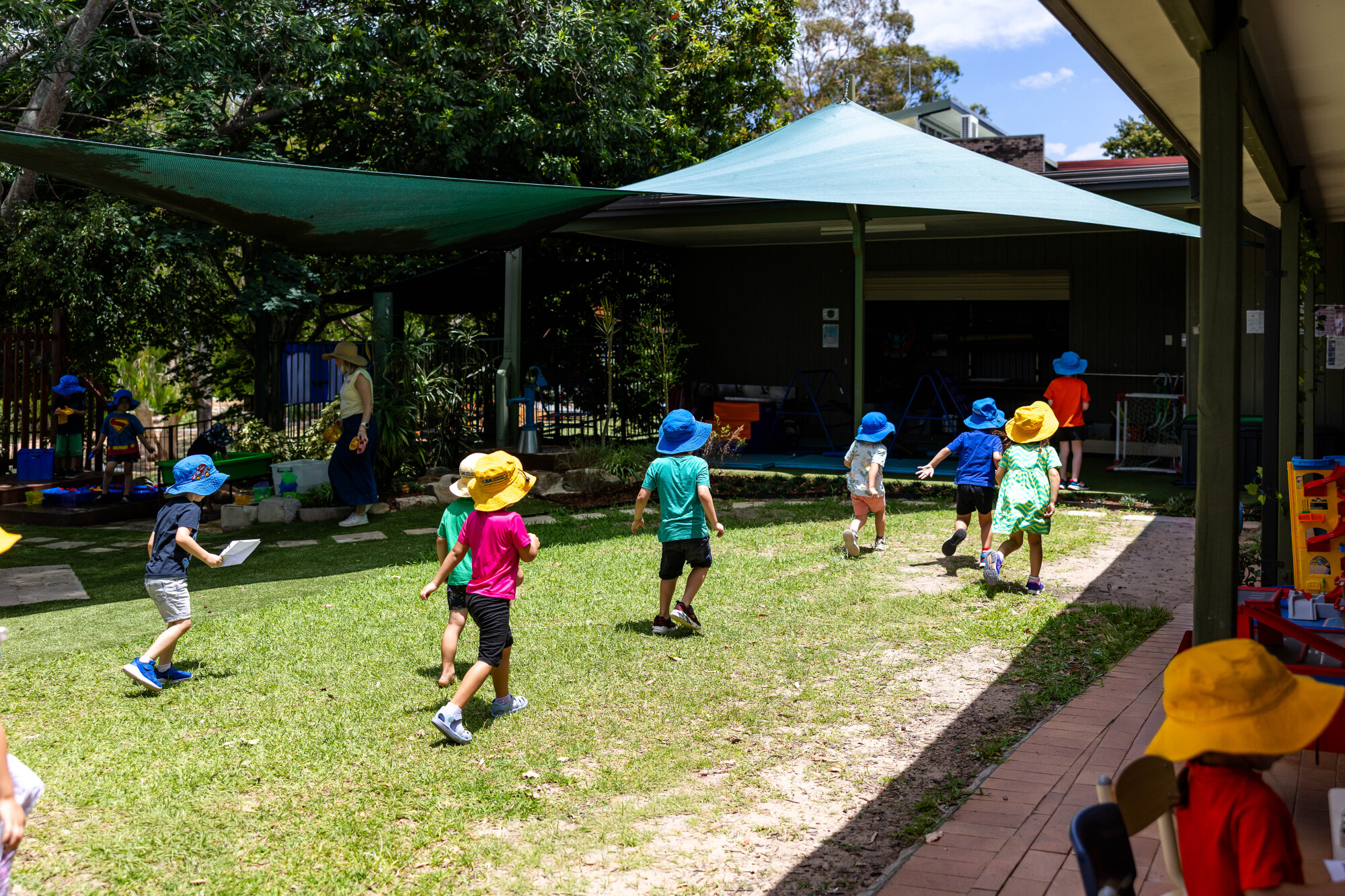 Kindy children running outside to play