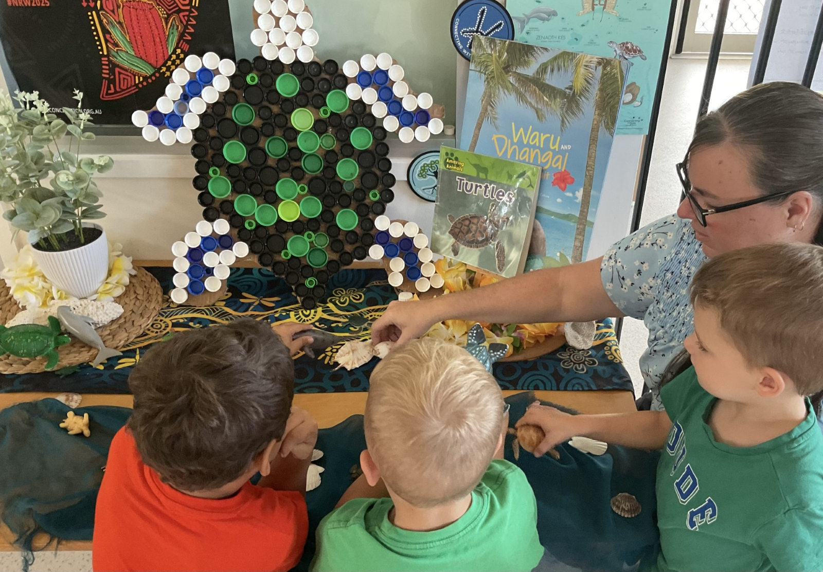 Photographed is Centre Director Kylie Krawczyk at C&K Kirwan Community Kindergarten with the children playing with cultural resources, extending what families have shared and taught with centre educators., Picture, Picture