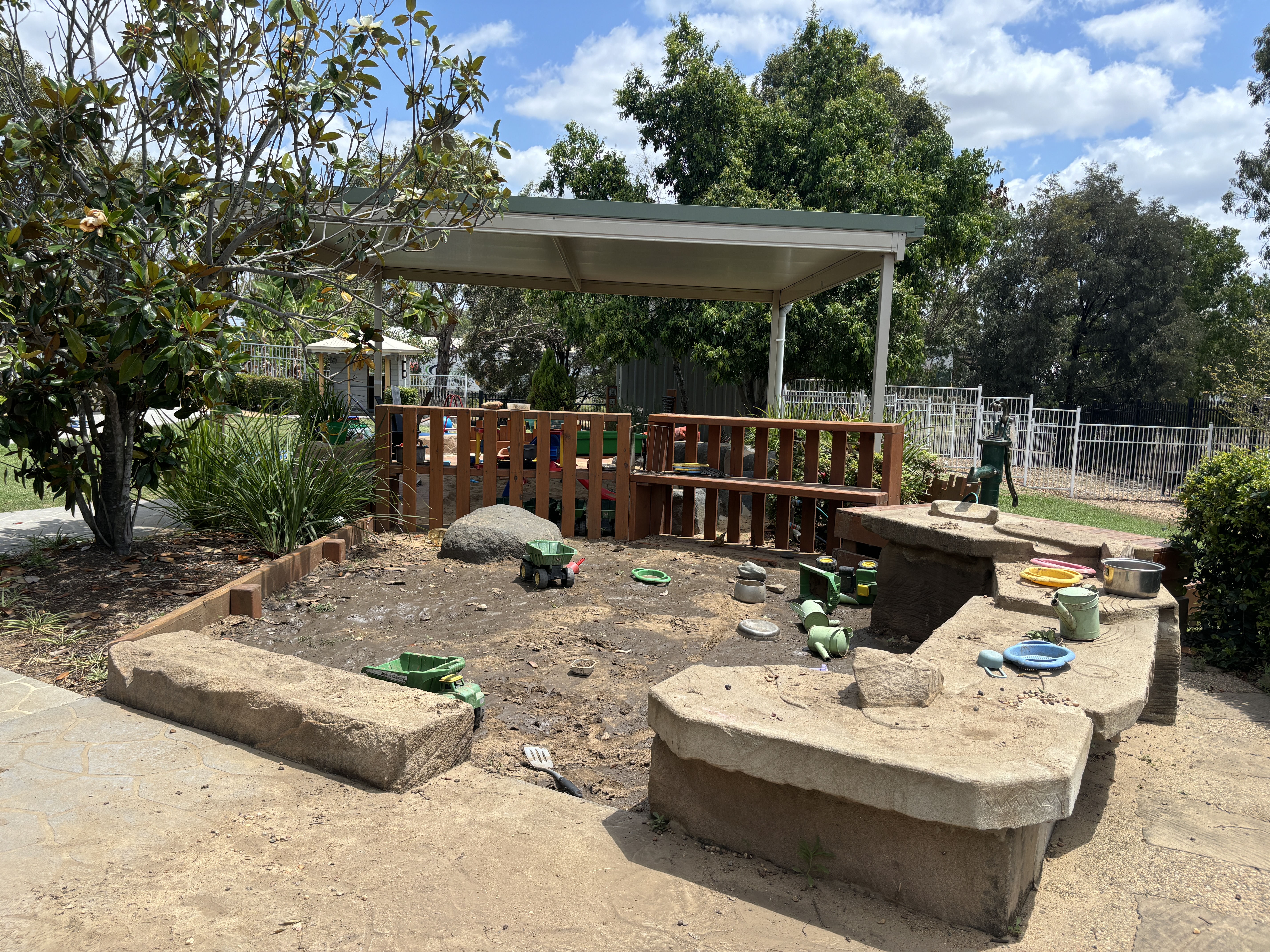 Mud pit and water fountain outdoor space