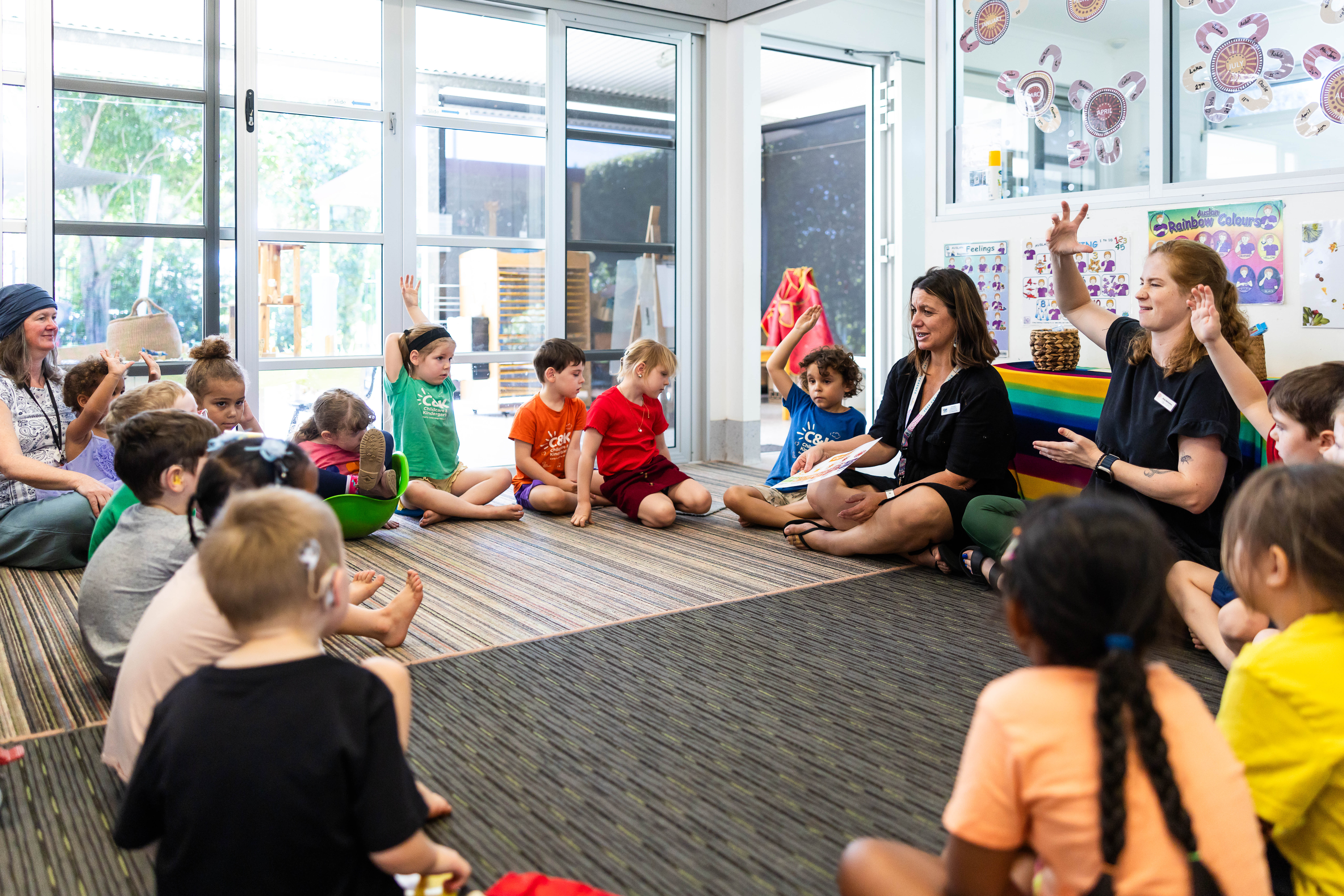Teacher signing in AUSLAN to group of children