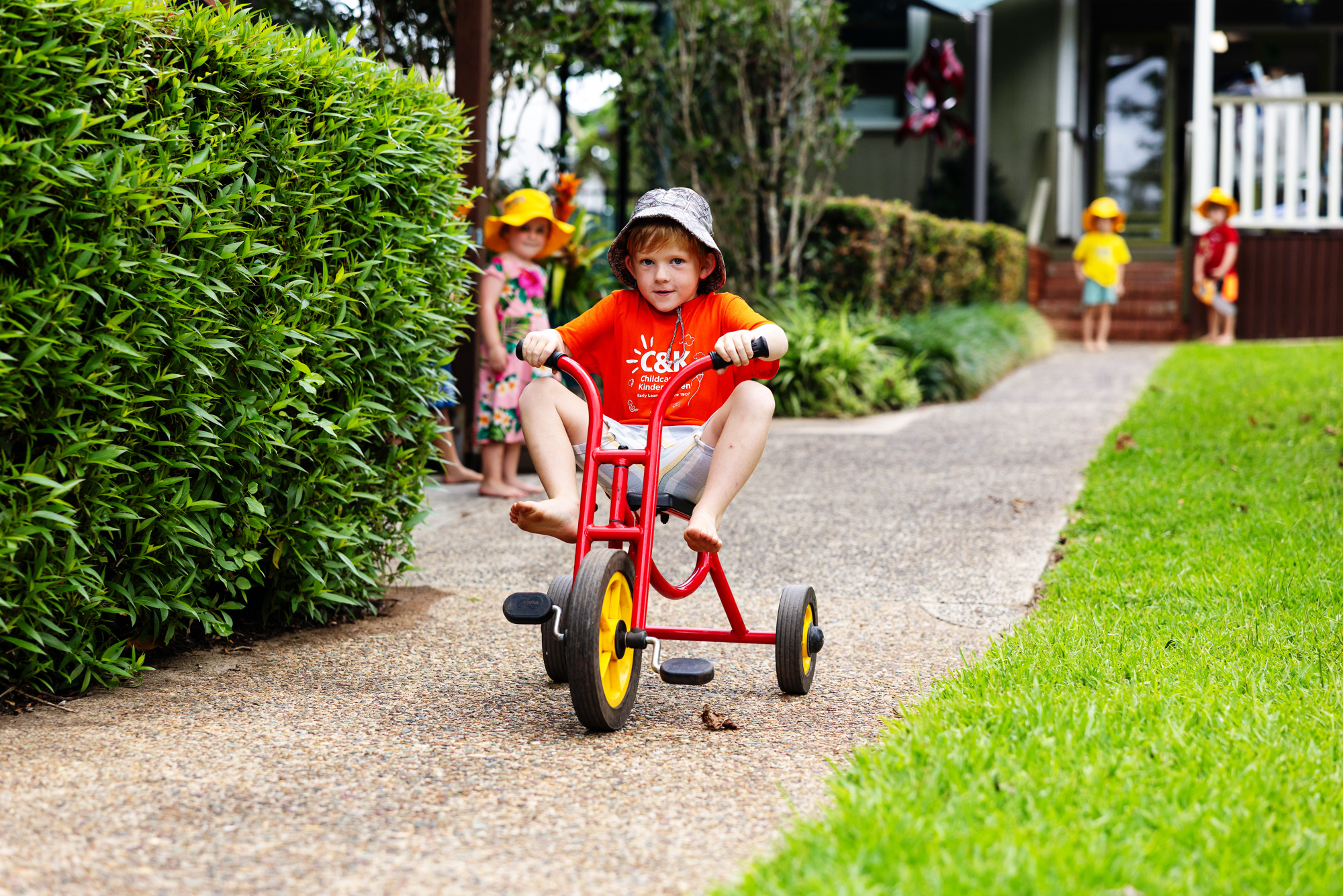 C&K Maleny - boy on tricycle
