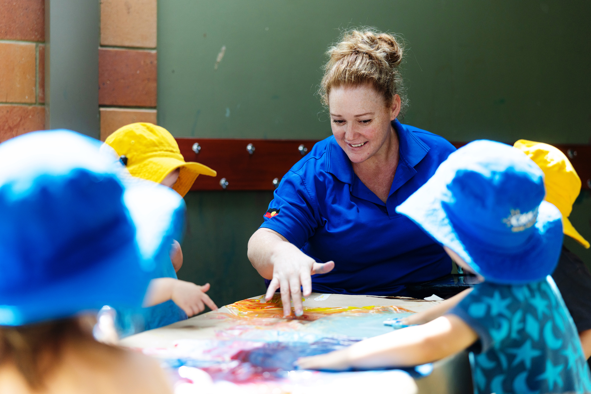 C&K Nambour - educator and children painting