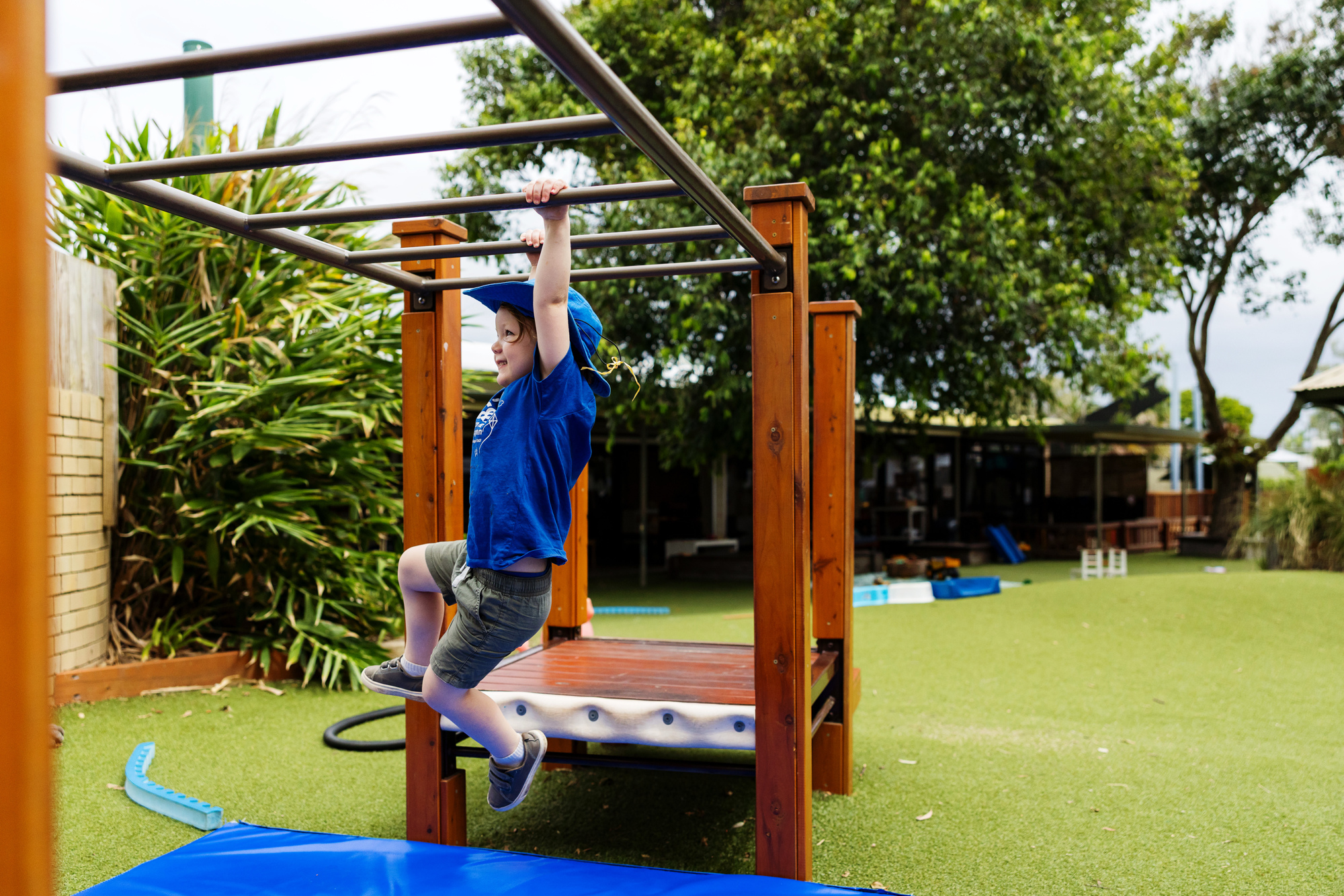 C&K Cotton Tree - child on monkey bars