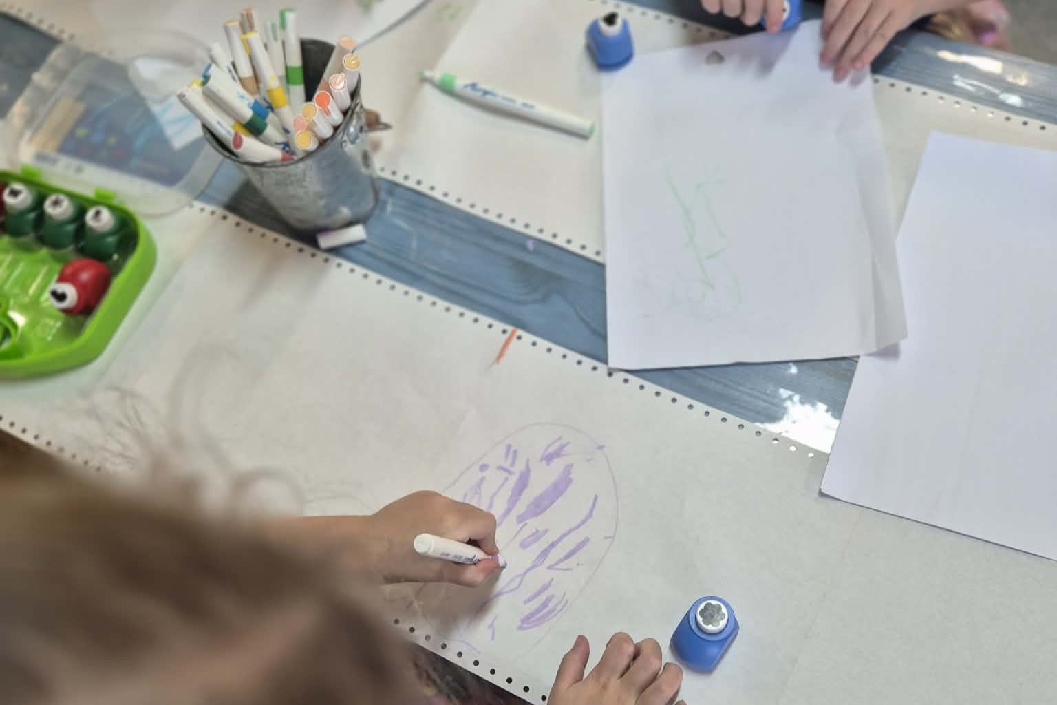 C&K Crescent Lagoon - children drawing and using a hold punch