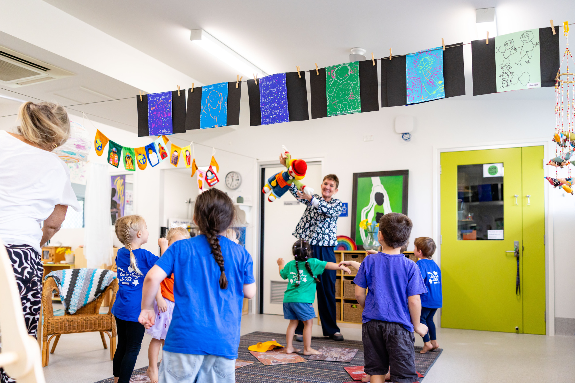 C&K Banksia Beach - educator and children dancing
