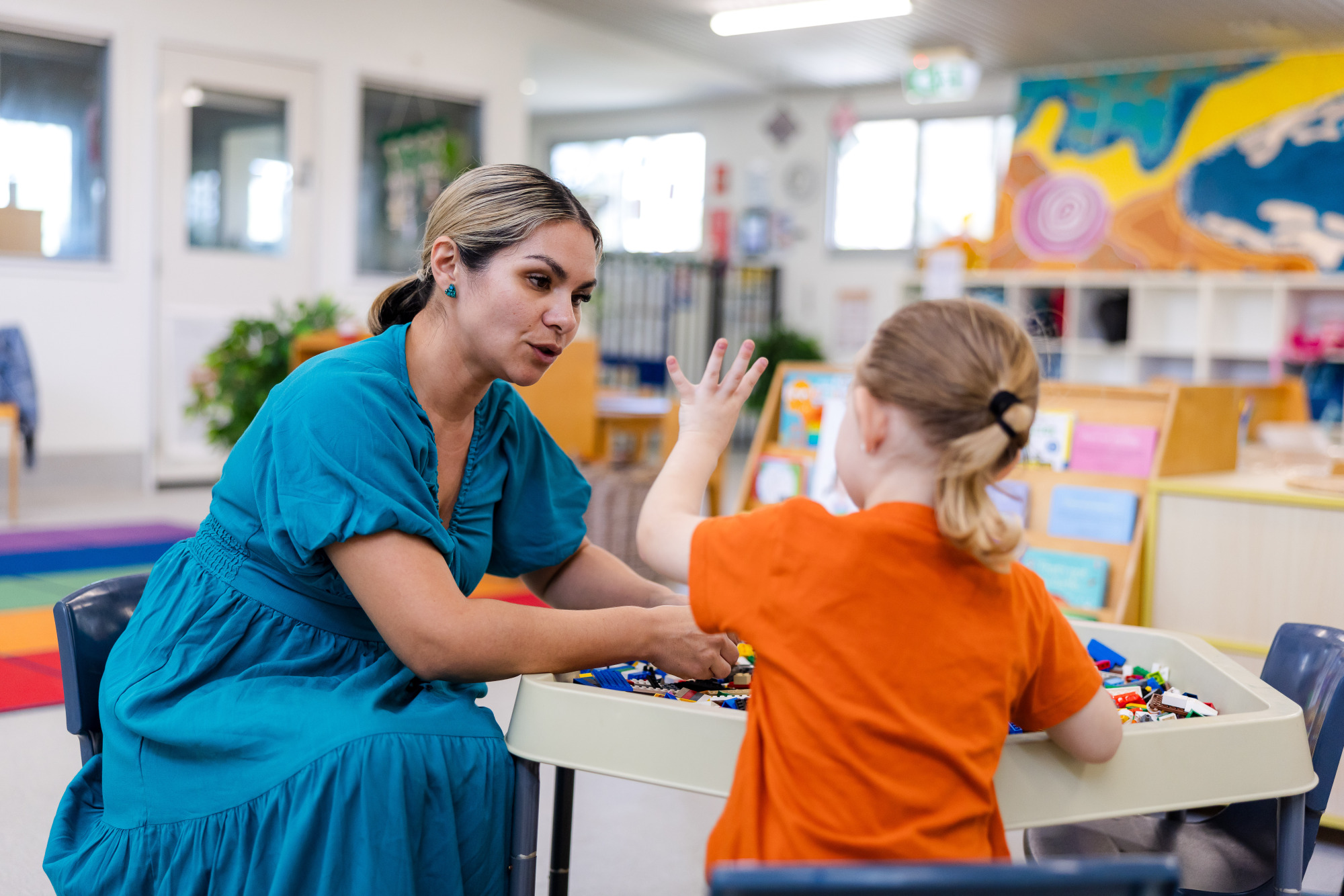 C&K Beachmere - teacher and child building with lego indoors