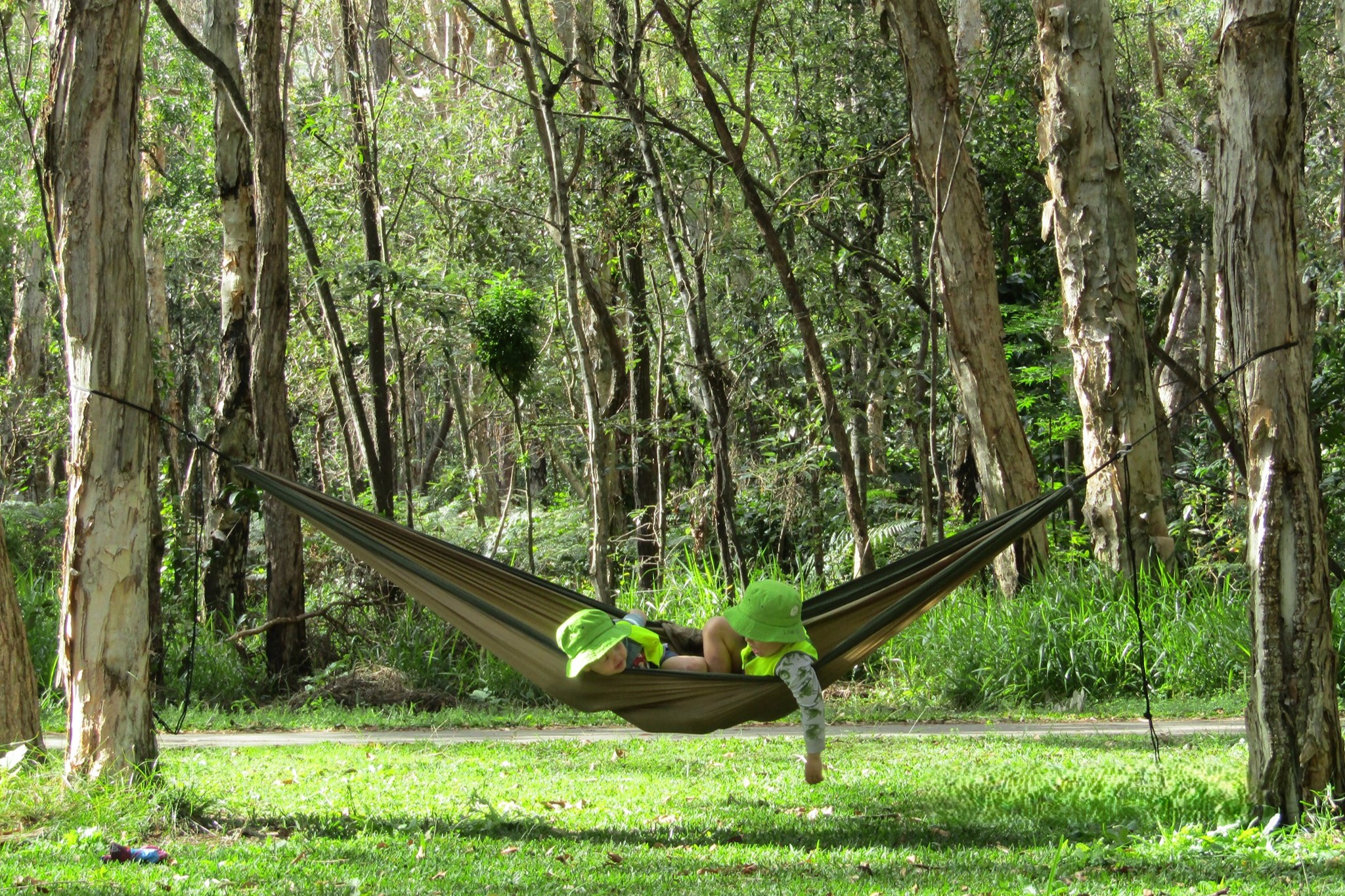 Bribie Island Kindy - 2 children in a hammock during bush kindy