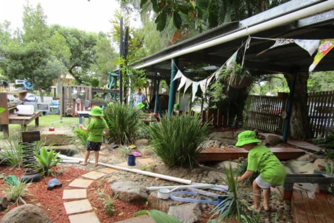 Bribie Island Kindy - children playing with a water run