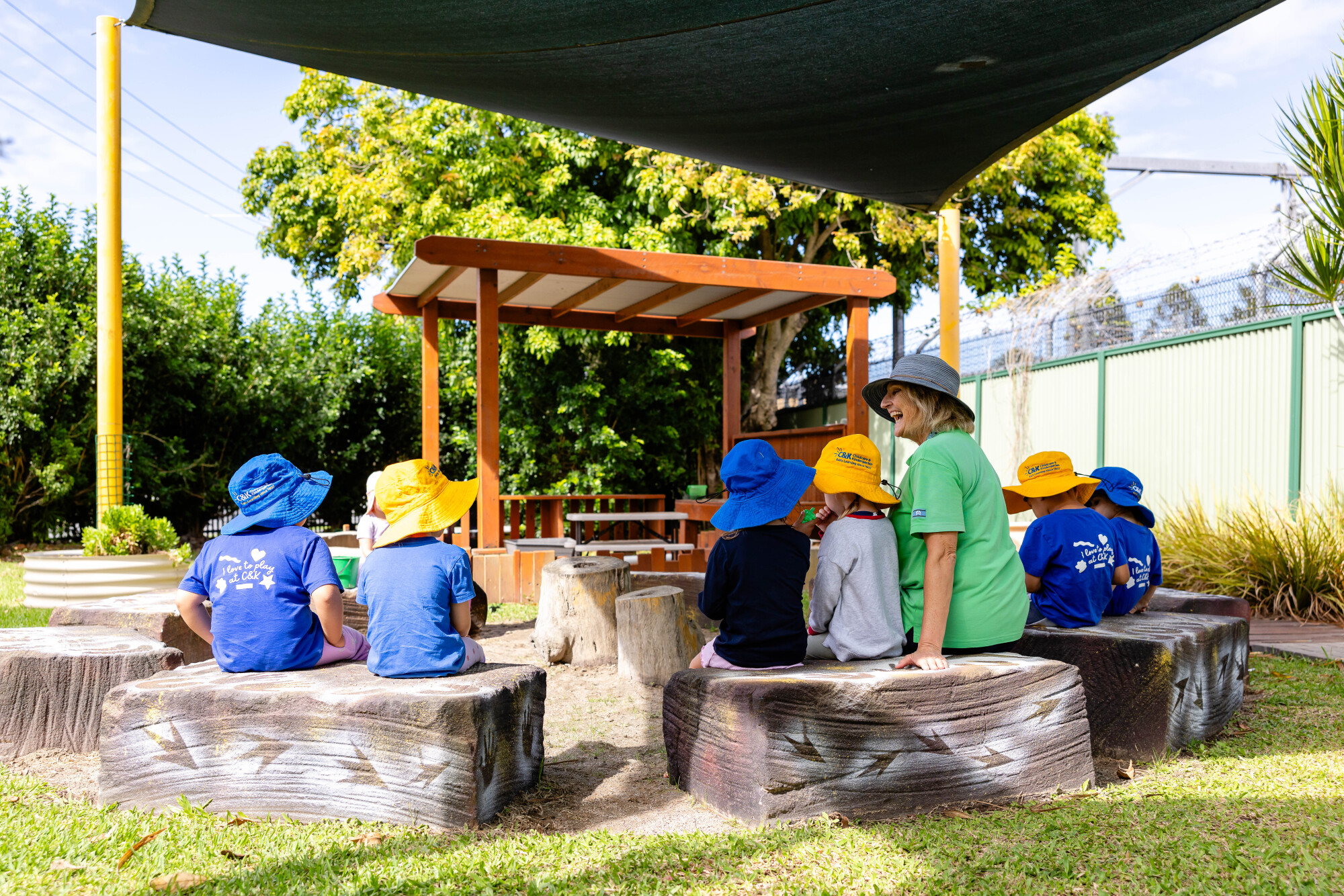 C&K Caboolture - educator and children sitting in the yarning circle