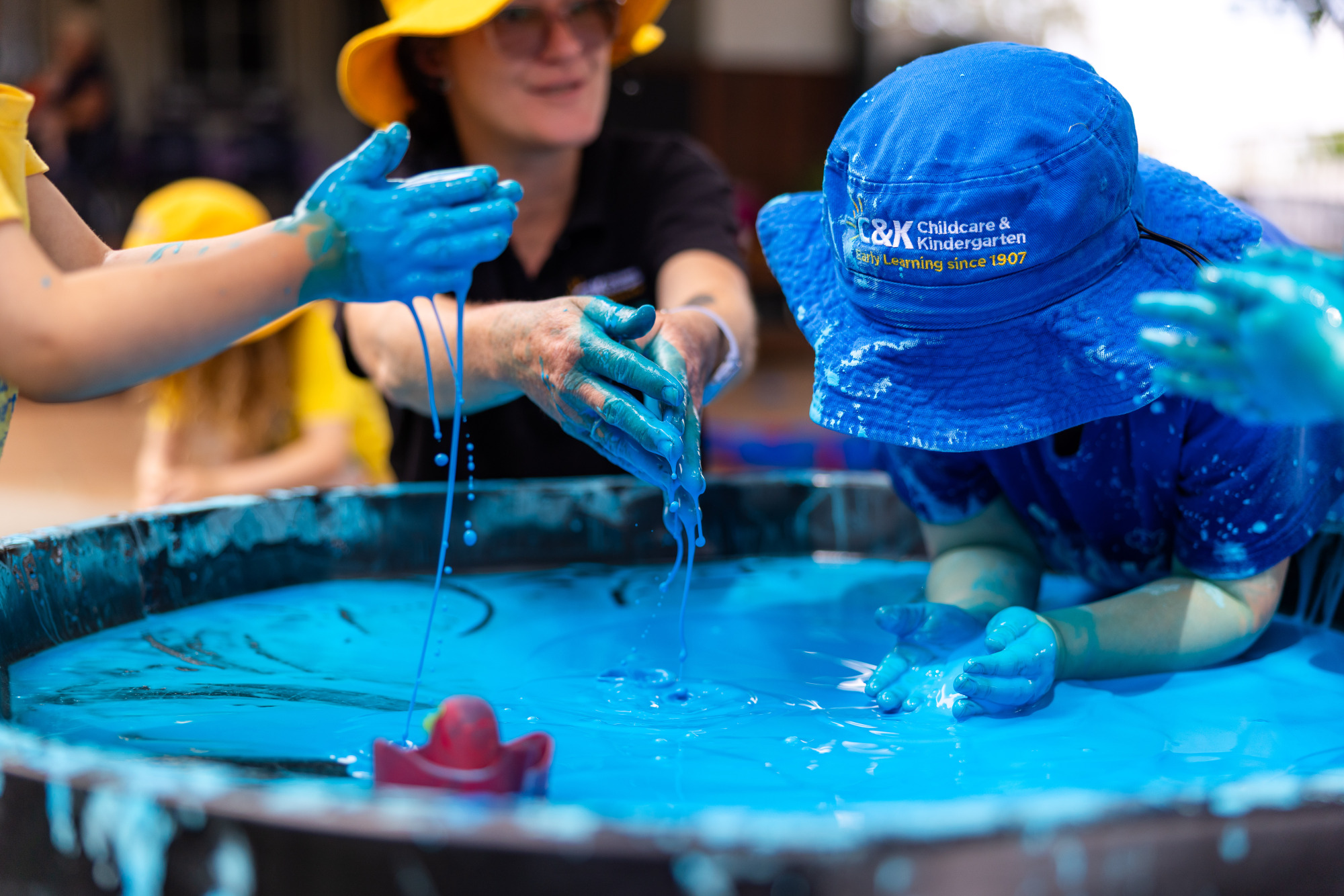 C&K Cambooya - educator and children playing with oobleck (slime)